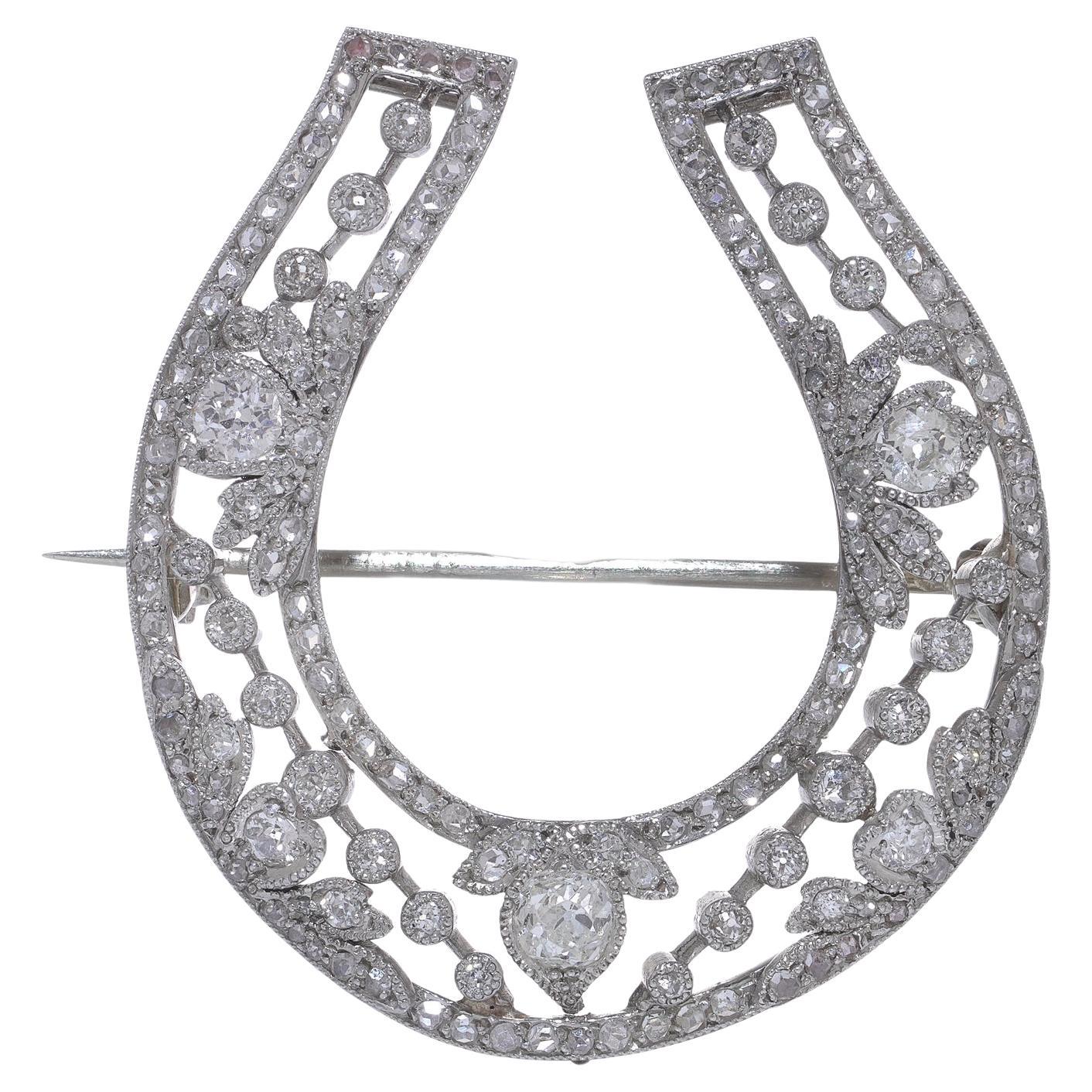 Broche en fer à cheval Belle Époque en platine et diamants