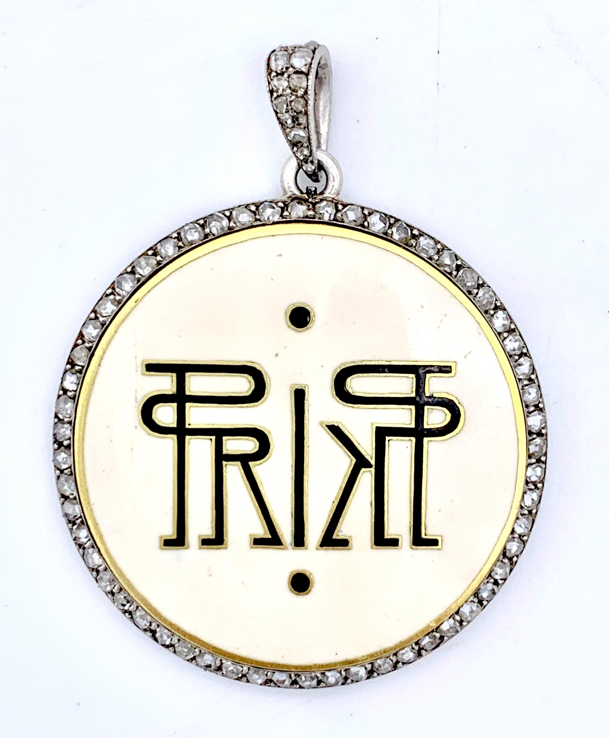 This highly unusual pendant with a mask was maybe presented as a souvenir of a wonderful masked ball.
The reverse of the pendant carries the initials of a prince  of the Cantacuzene family, an old Rumanian aristocratic family.
Black and white enamel