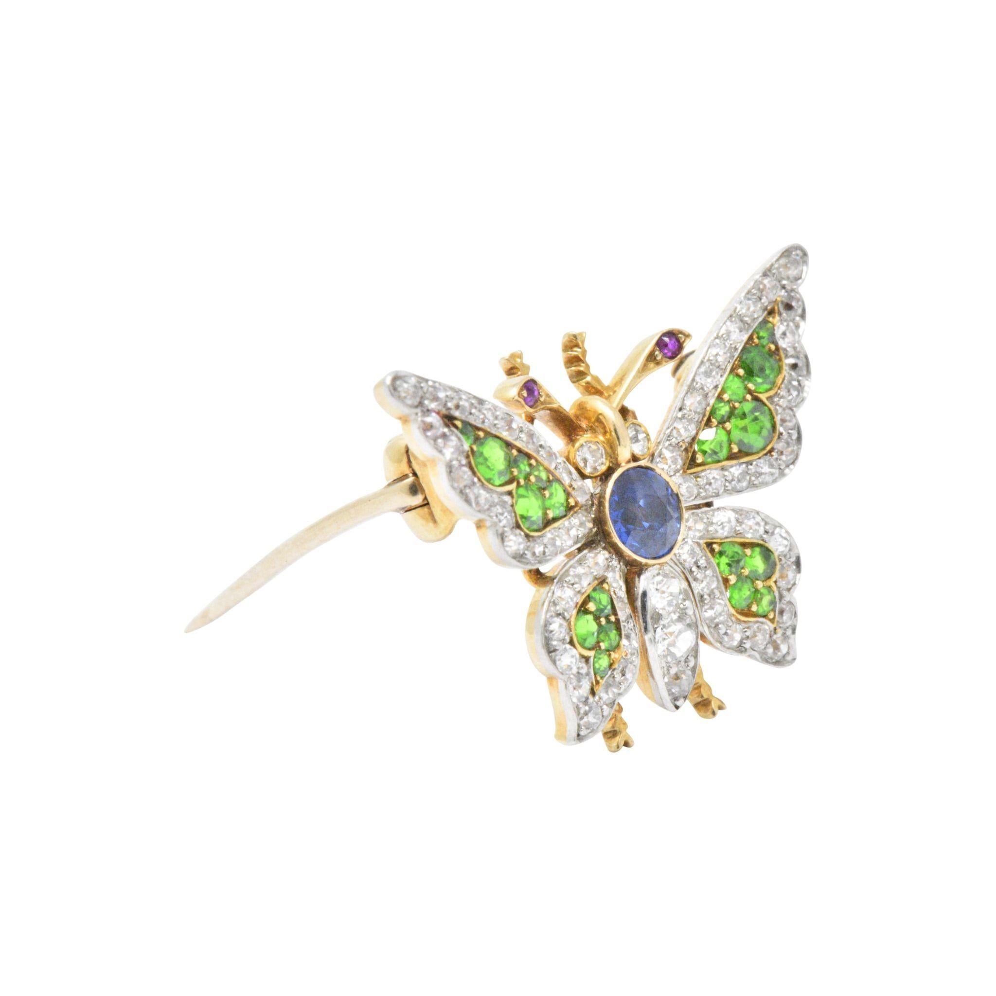 Designed as butterfly centering a round cut vivid blue sapphire weighing 0.30 carats
Old Mine cut demantoid garnet 