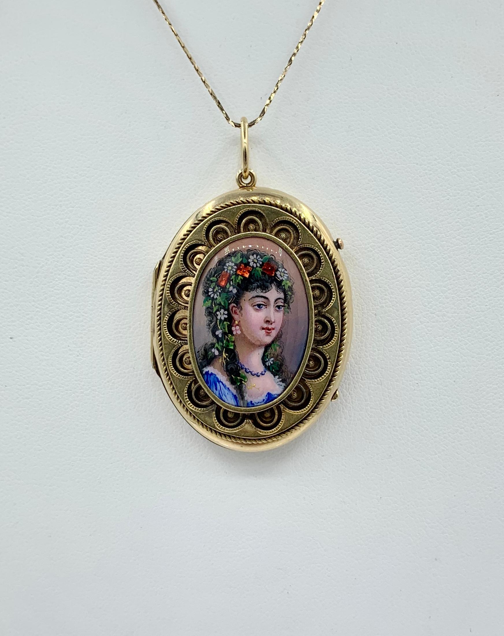 This is a Museum Quality Antique Victorian - Belle Epoque Locket Pendant with exquisite Swiss Enamel Portrait decoration of a woman with a garland of flowers in her hair with an exquisite open work border design in 14 Karat Gold.  The locket dates