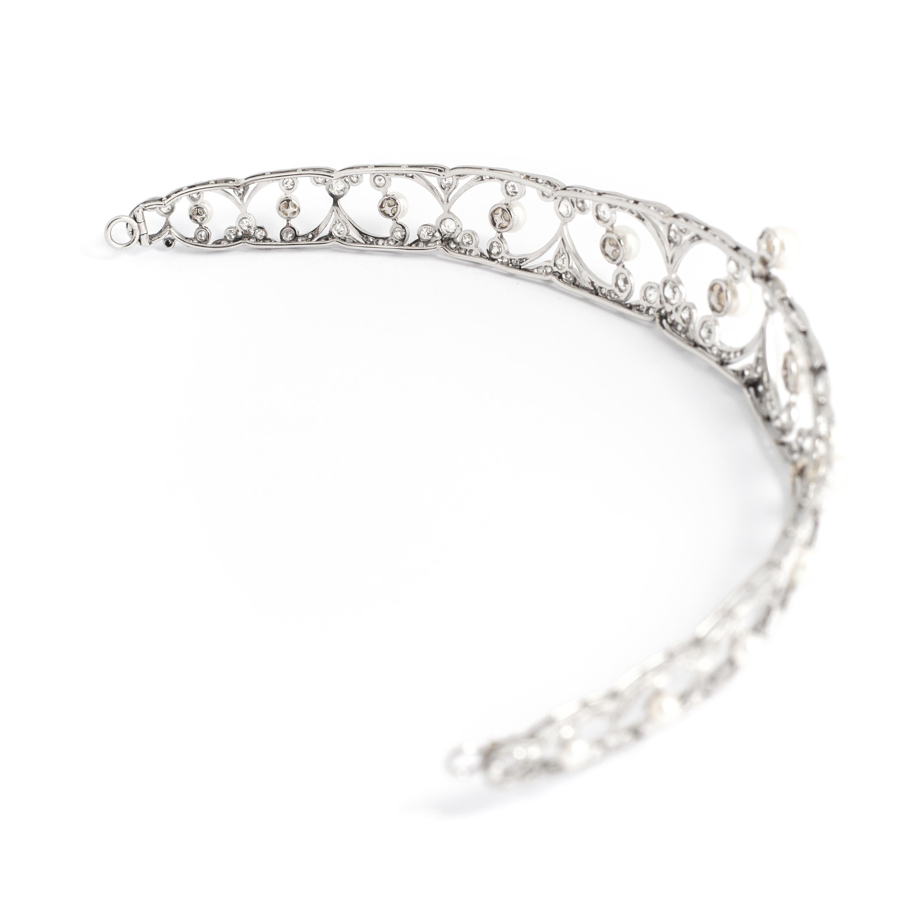 Belle Epoque Tiara diamond and pearl. Total 14.00 carats on platinum and white gold.

Length: 7.48 inches (19.00 centimeters)
Width: 5.41 inches (14.00 centimeters)
Height: 0.87 inch (2.20 centimeters at the highest)