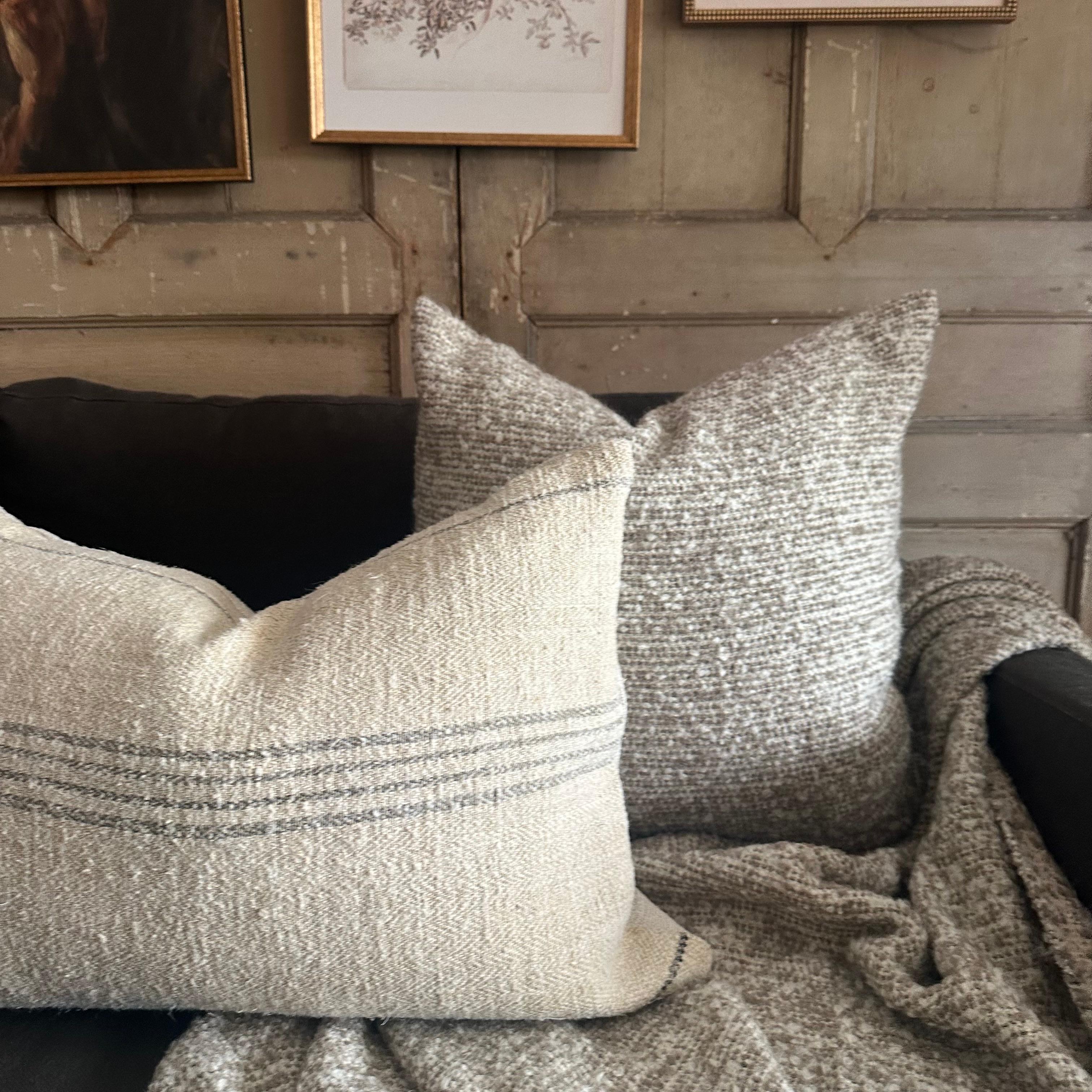 Woven in Belgium the Bell Pillow combines a fluffy boucle wool with a silky soft viscose/linen. 

Content: 41% Viscose / 19% Linen /16% Acrylic /9% Alpaca/ 9% Virgin Wool
4% Polyester/2% Polyamide
Size: 23