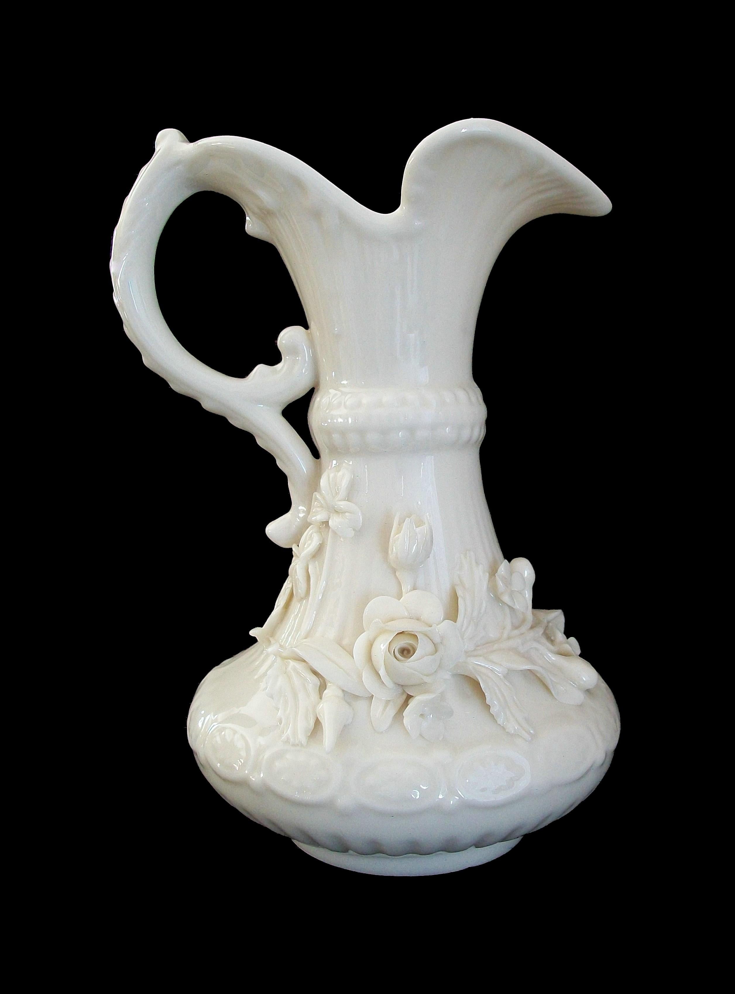 BELLEEK (Manufacturer) - Vintage ceramic ewer - featuring applied porcelain floral decoration to the body - 3rd green maker's mark to the bottom - Ireland - circa 1965-1980.

Excellent/mint vintage condition - no loss - no damage - no restoration