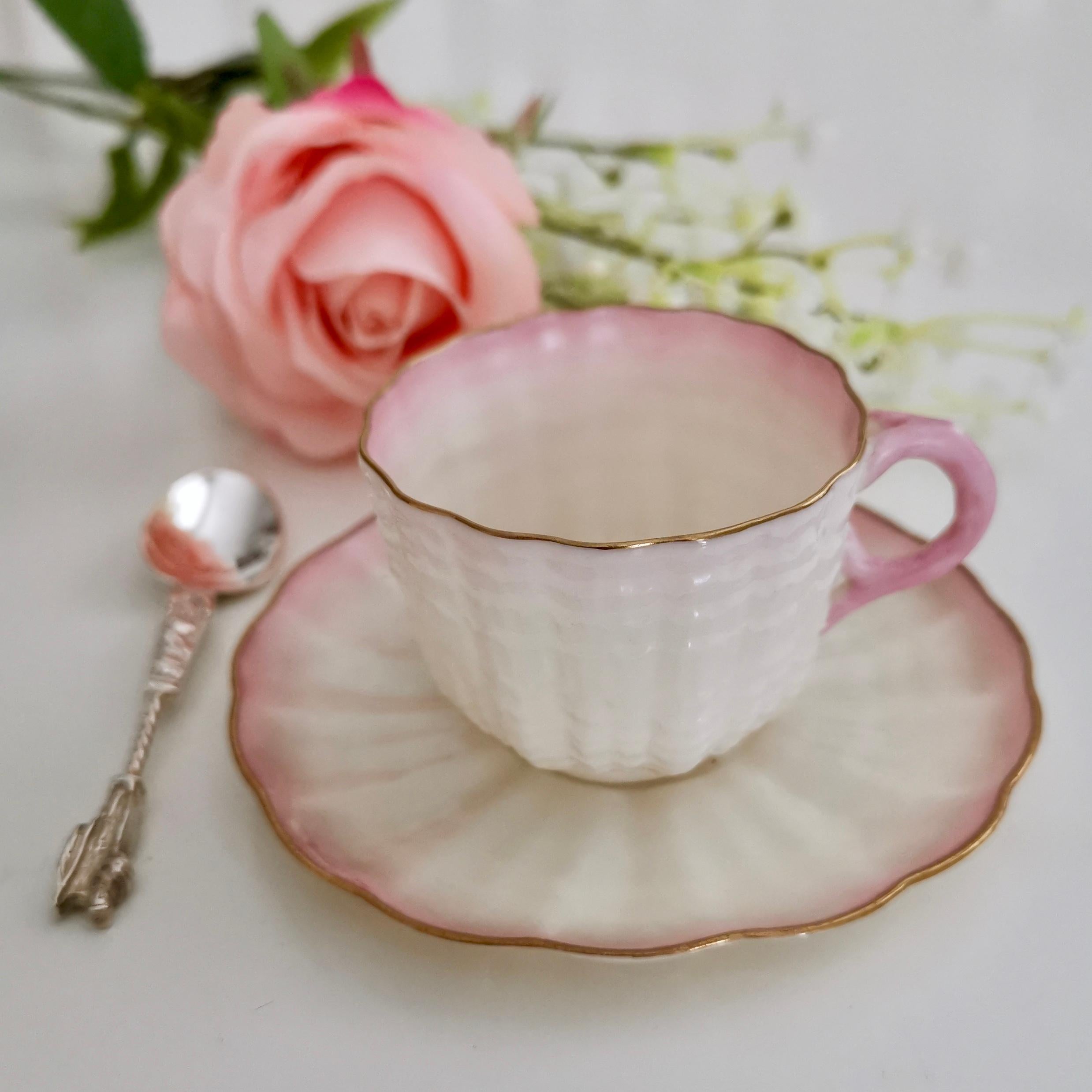 This is a beautiful Belleek demitasse cup and saucer in the pink Tridacna design with the 2nd Black Mark, which was used between 1891 and 1926. This cup is tiny; it holds a single espresso.

These demitasse cups are rare so this is a great