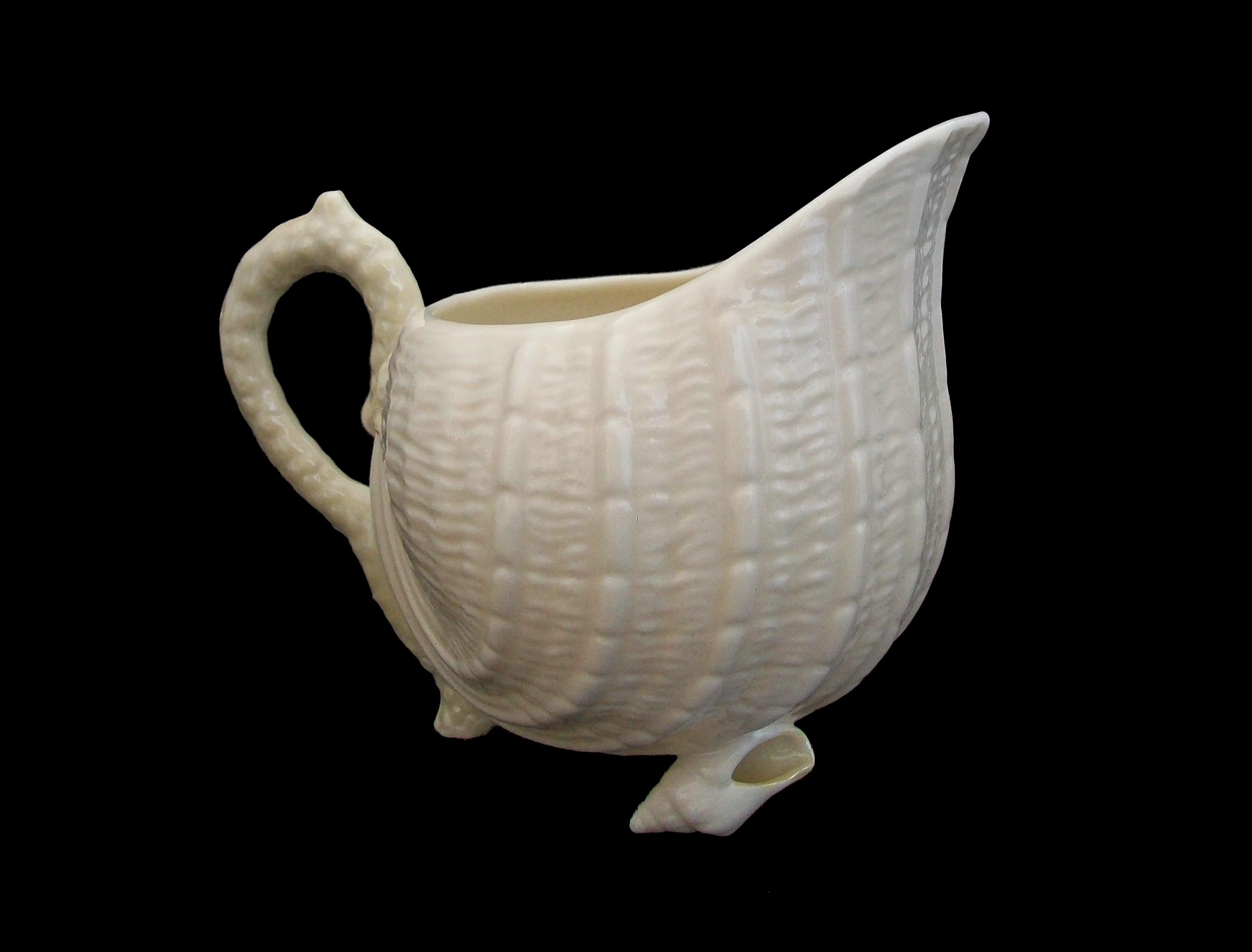 BELLEEK (Manufacturer) - ' Neptune ' (Pattern) - Vintage porcelain cream jug - large Size - featuring a yellow iridescent glaze to the handle - green maker's mark to the bottom - Ireland - circa 1965 to 1980.

Excellent/mint vintage condition -