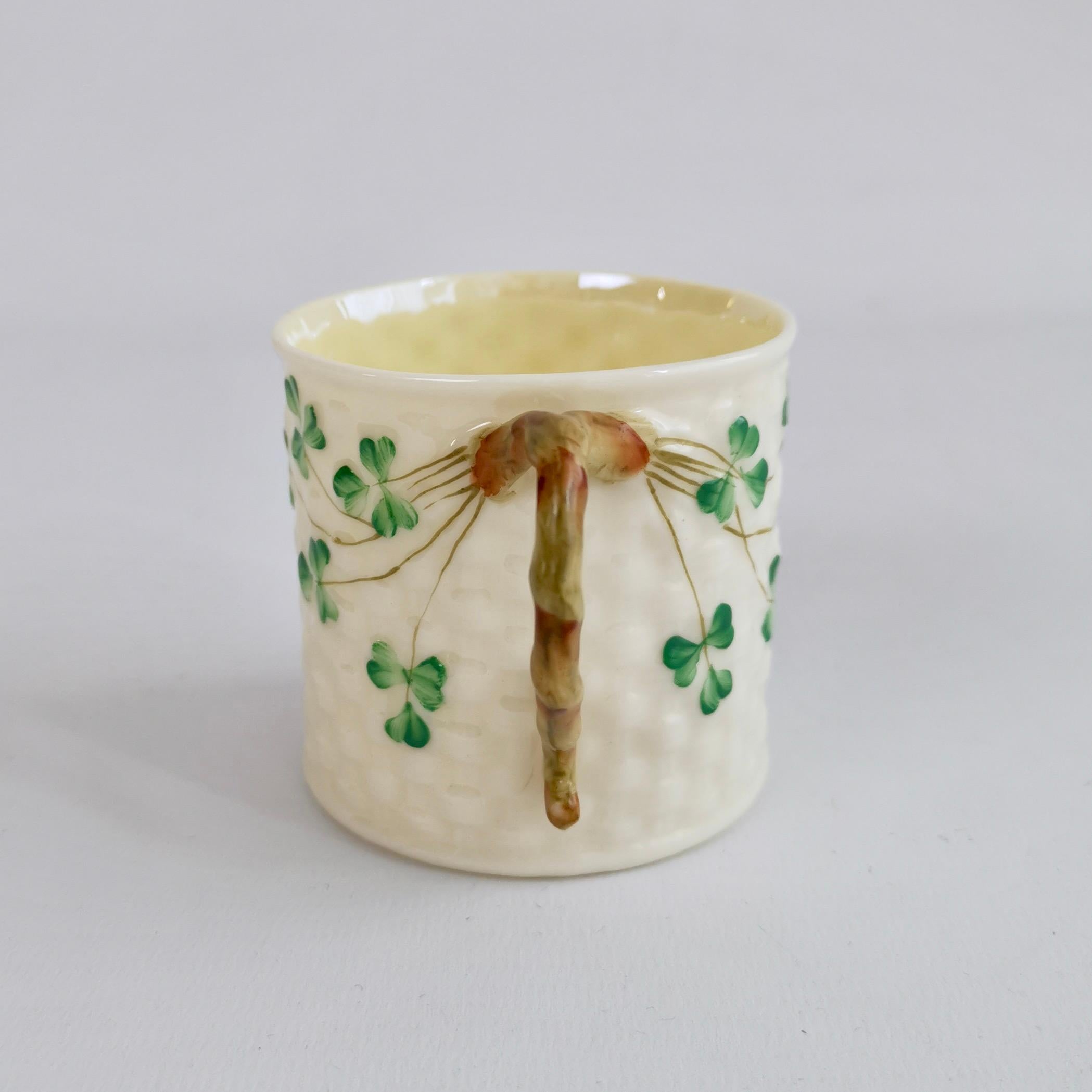 This is a very charming small mug made by Belleek in the Shamrock design. It has the 3rd Black Mark, which was used between 1926 and 1946. The mug is fine and small - it would hold about one flat white.

I have one more of these available, if