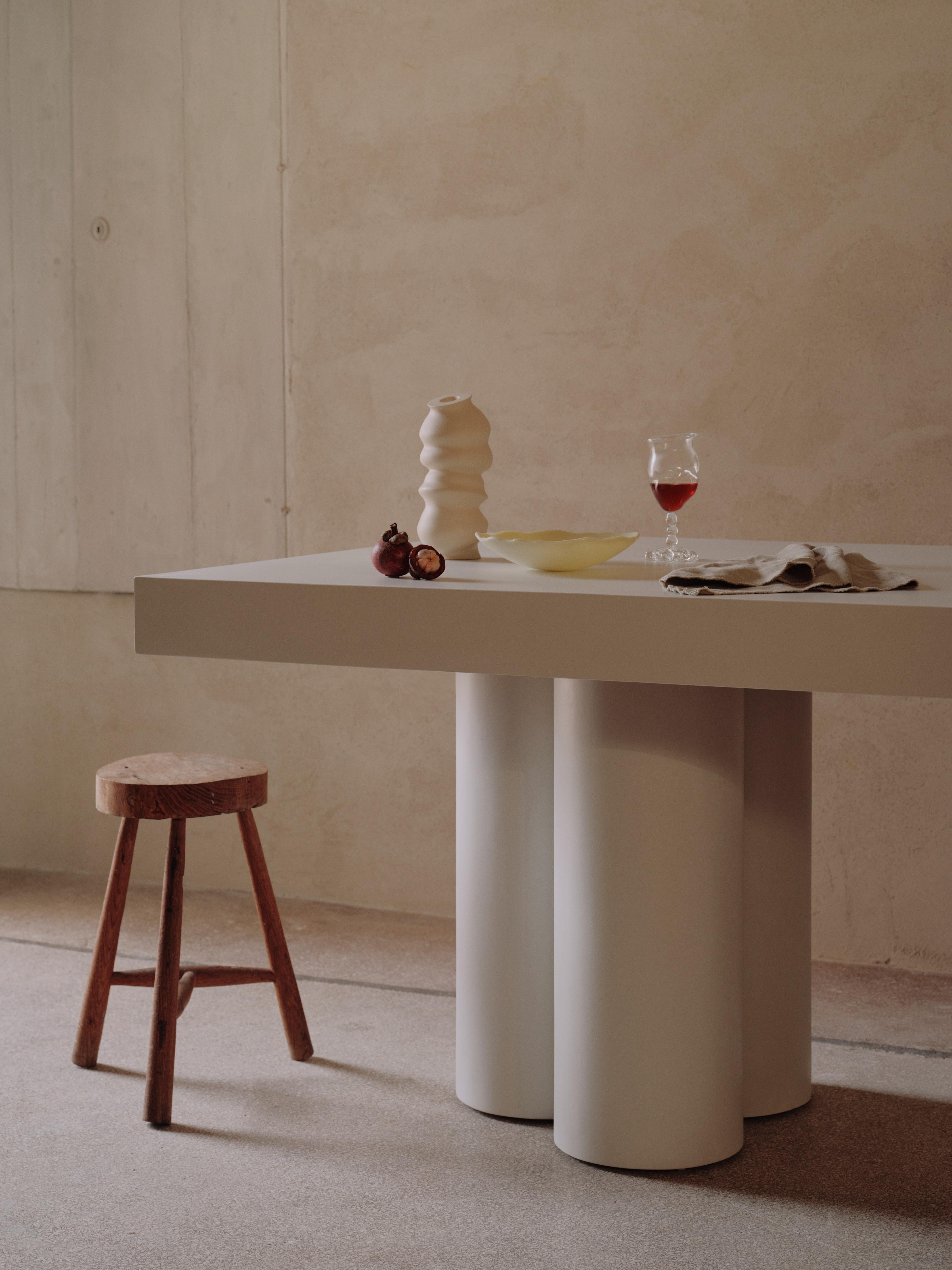 Handcrafted in Spain by expert artisans, this oval-shaped dining table from Marlot Baus combines timeless design with modern craftsmanship. Each piece is carefully made using our signature microcement technique, layered by hand to achieve a smooth,