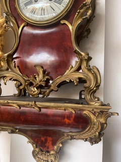 Orologio antico Luigi XV da console in lacca effetto tartaruga e bronzo dorato