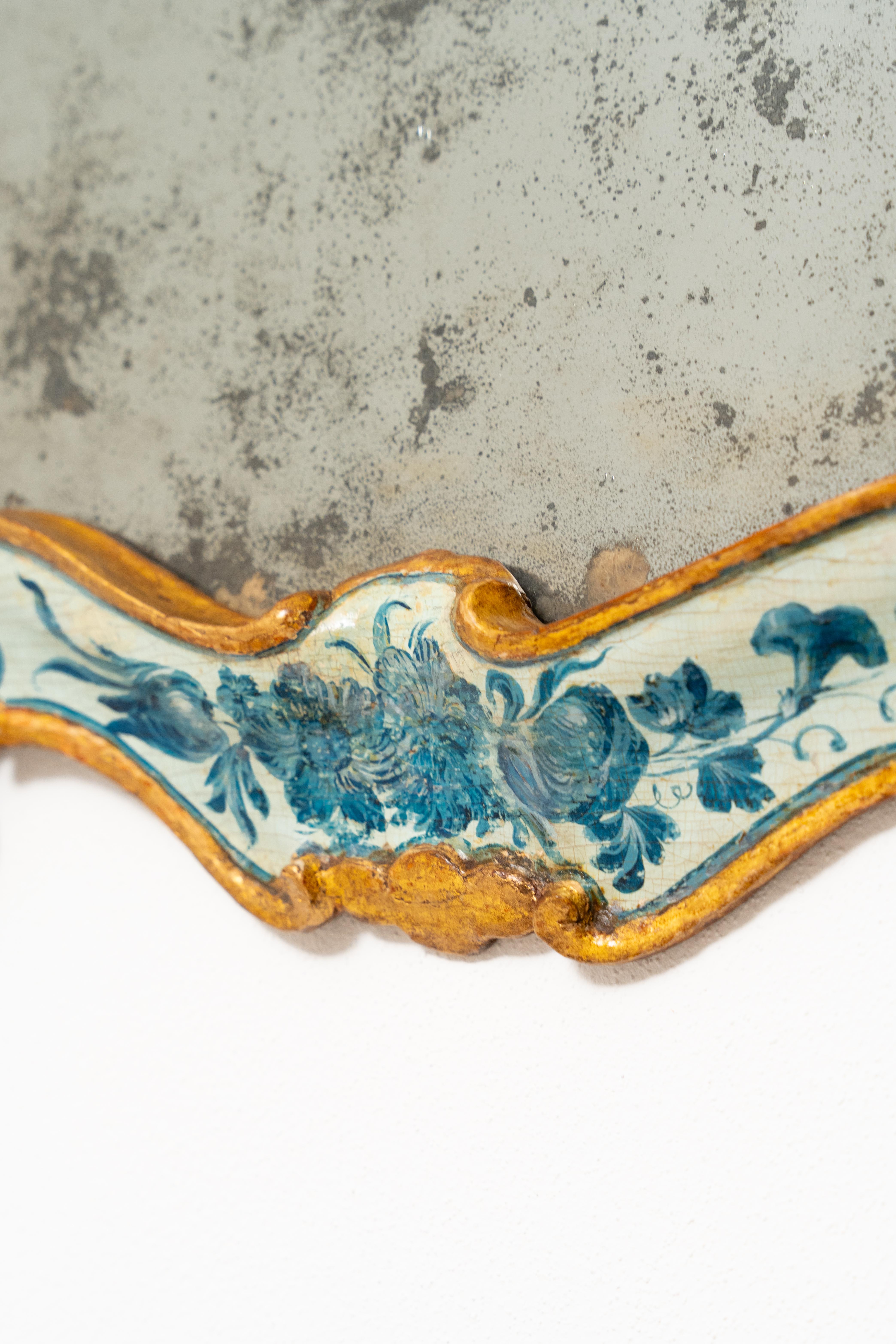 Italian Beautiful Venetian mirror made of lacquered and gilded wood.