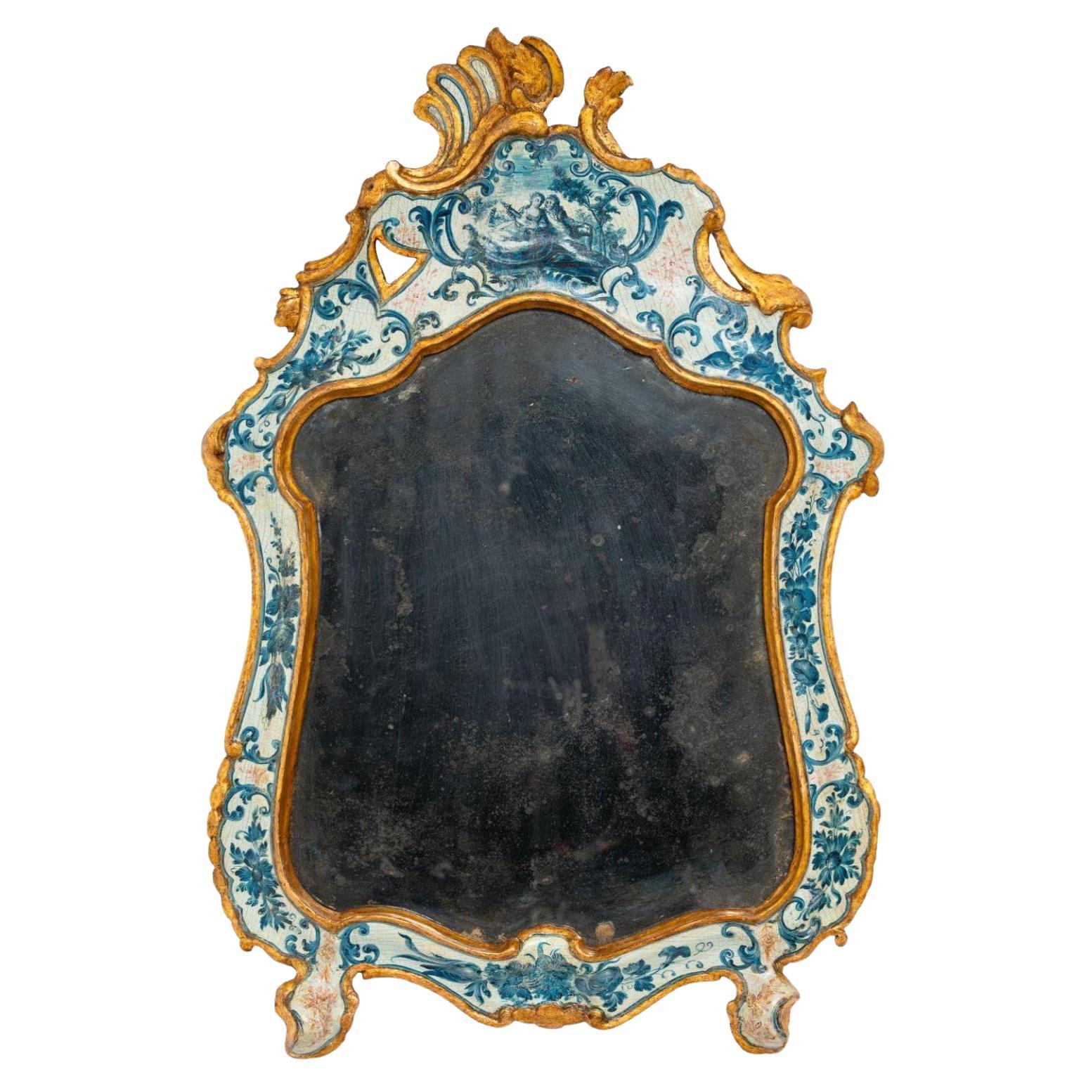 Beautiful Venetian mirror made of lacquered and gilded wood.