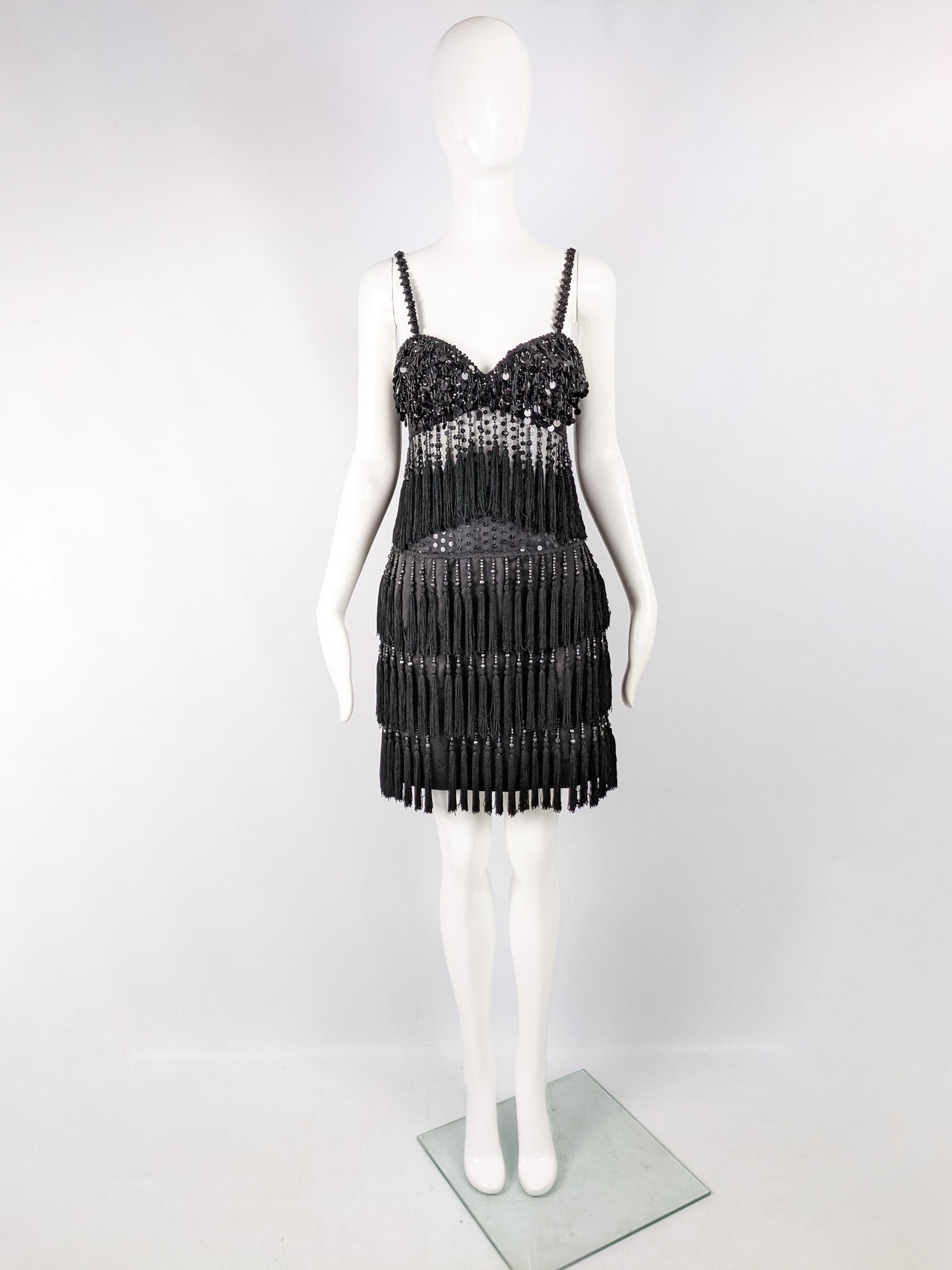 An incredibly sexy vintage womens party / evening dress from the 80s by luxury British label, Bellville Sassoon. In a beaded mesh fabric that is sheer at the midriff with amazing fringes creating amazing movement and a 1920s inspired flapper look.