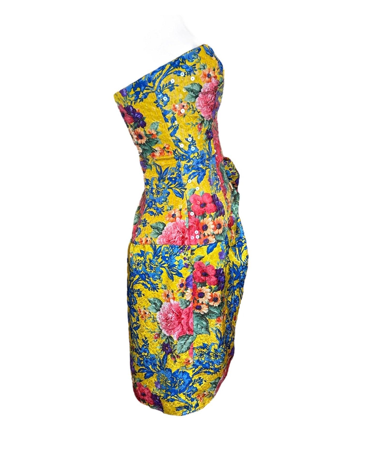 Transport yourself to an English rose garden with this bouquet of beauty by English designers Bellville Sassoon. An 80s staple, Bellville Sassoon was of of Princess Diana's go to designers- how very posh indeed! This gorgeous silk cocktail dress is