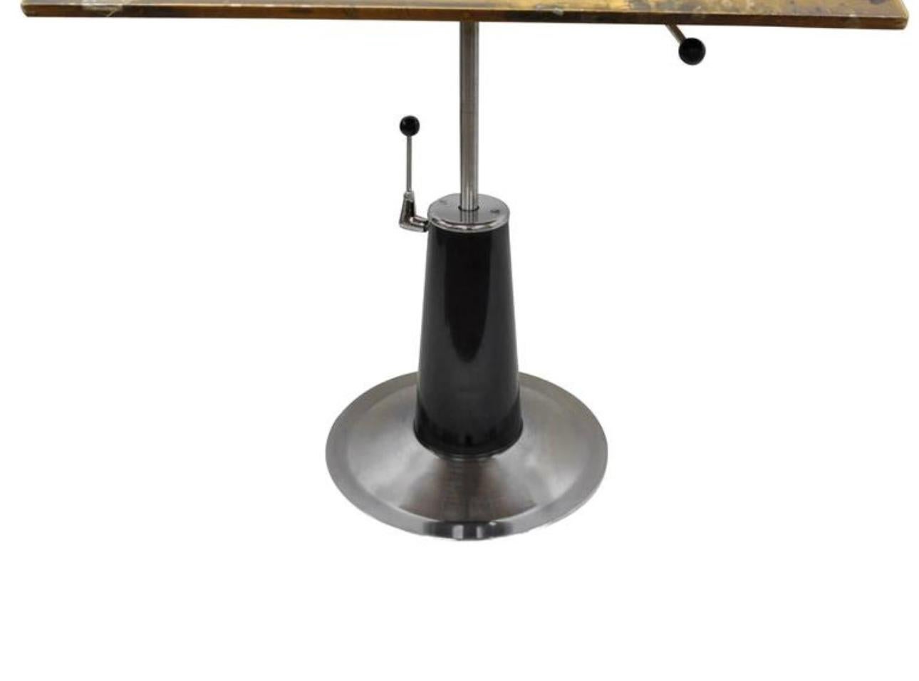 Mid Century Modern / Art Deco adjustable hydraulic architectural drafting or working table,
by Belmont 1940s / 50s
The table is equipped with a hydraulic lift height adjustment system and locking mechanism, which allows the work platform to swivel