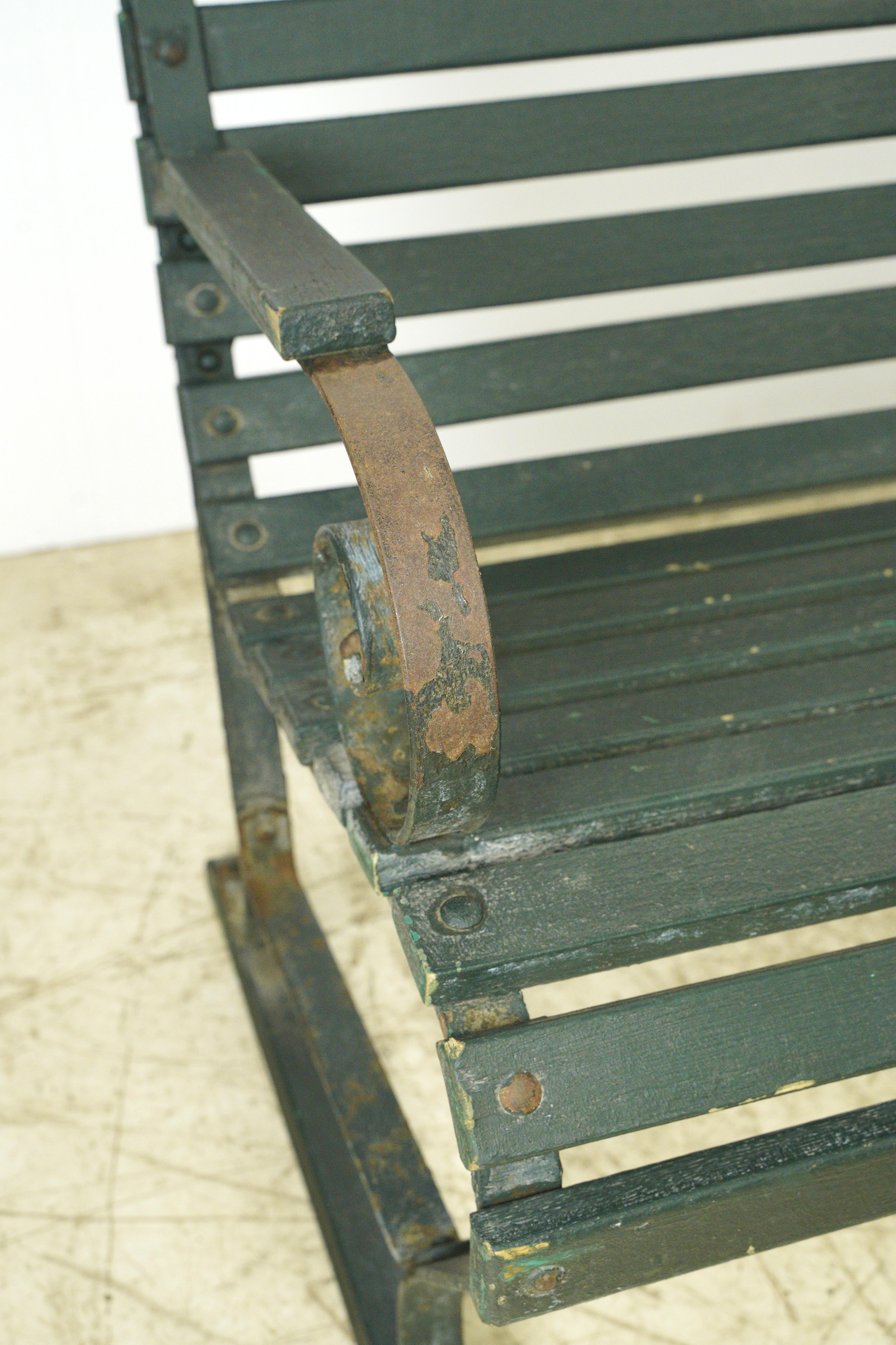 Belmont Park Racetrack in Elmont, New York oak park bench.  These green painted ones were outside the main stadium and are nicely weathered. The natural finished oak benches (separate listing) were under a roof and protected from the elements. Small