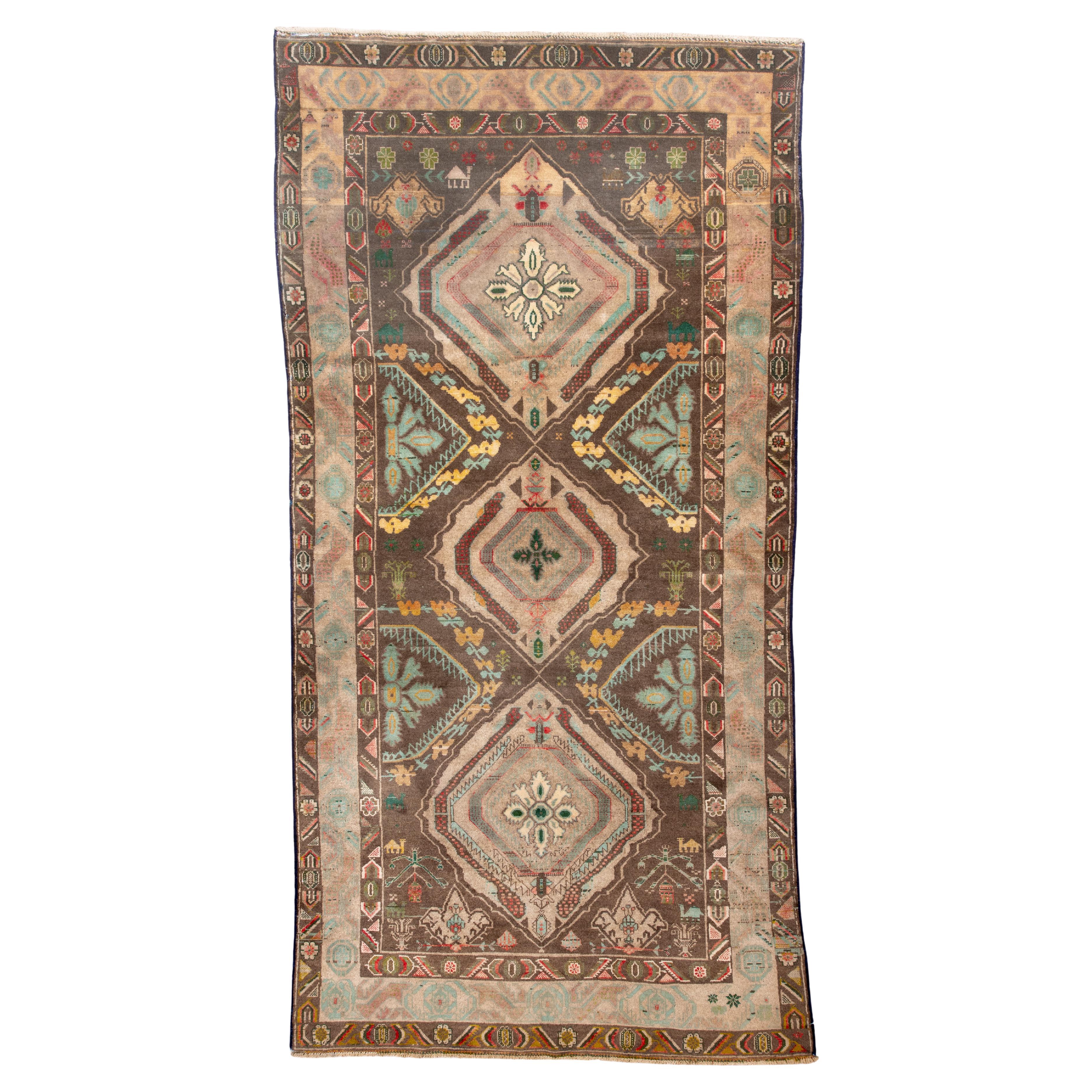 Belouch Rug with Stacked Diamond Medallions 
Tribal Borders in Earthy Neutrals For Sale
