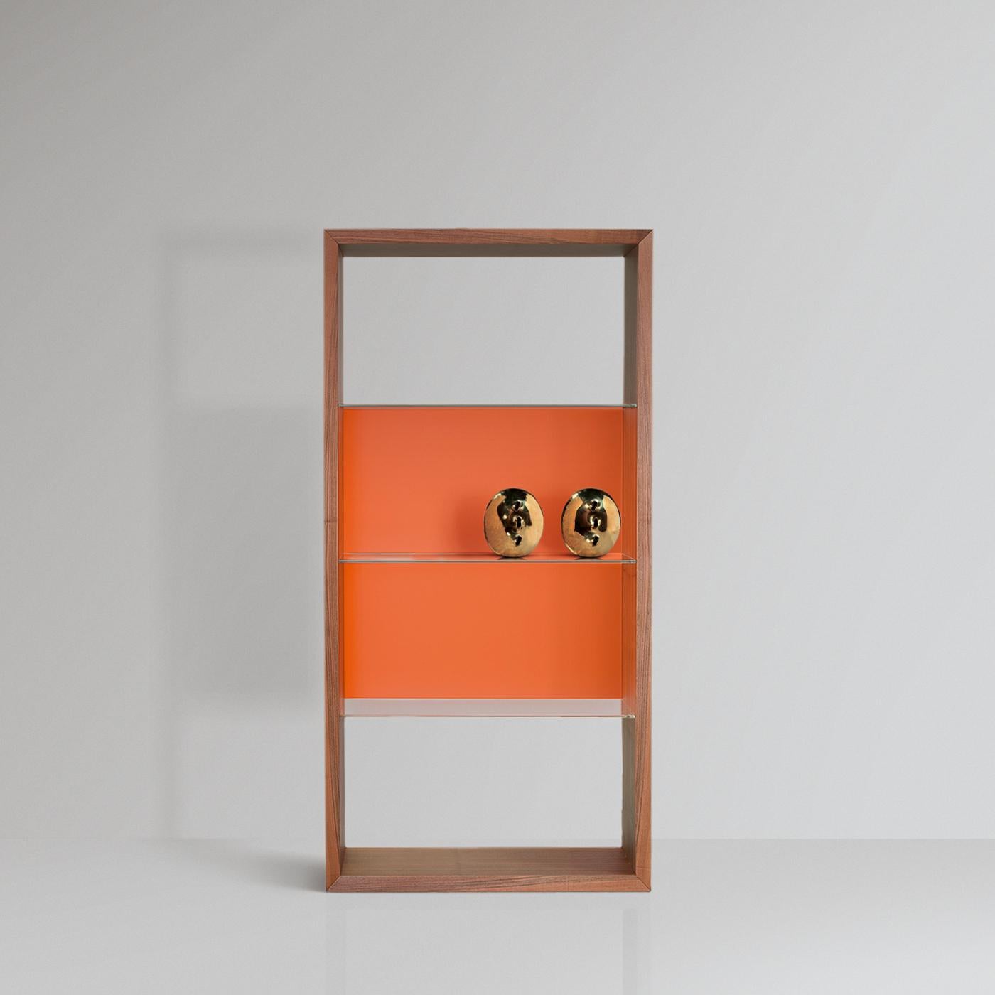 Boasting a symmetrical silhouette with a timeless design, this bookcase is made for displaying bedroom treasures and trinkets. The harmonious combination of empty and full volumes creates a textured decoration for an elegant wall, where natural