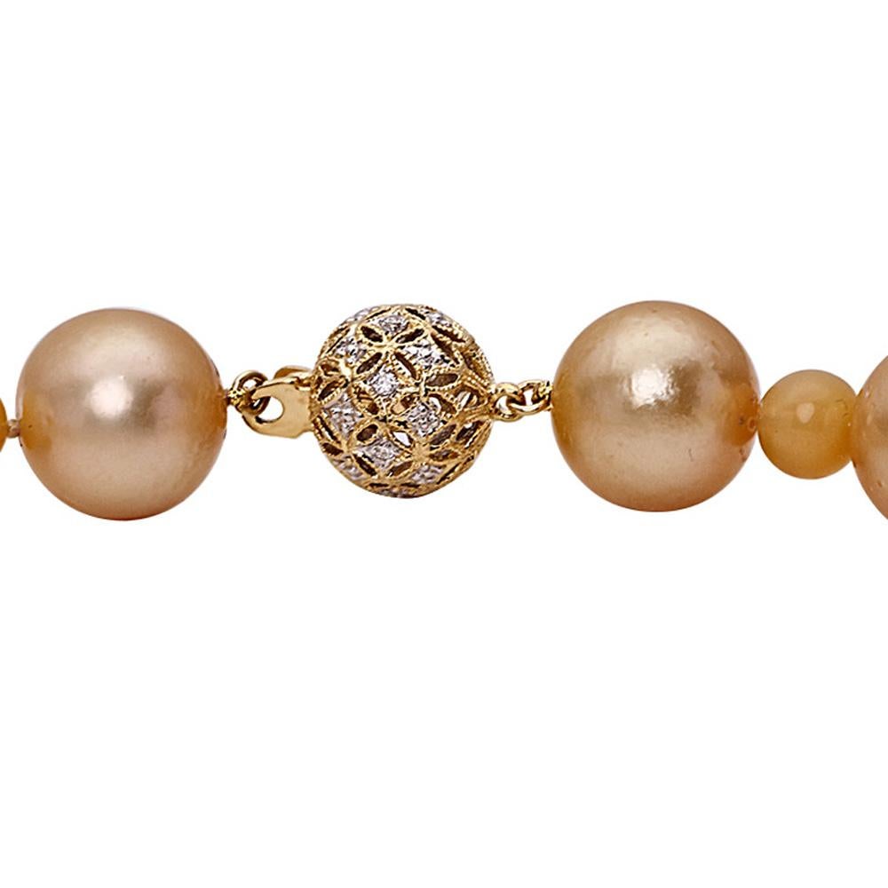 Golden South Sea Pearl Necklace
Length: 18 inch
Pearls: 23  14.3-11.2 mm Round Golden South Sea Pearls
Stones: Opals and 0.11 carat Diamonds
Gold: 18K Yellow Gold

