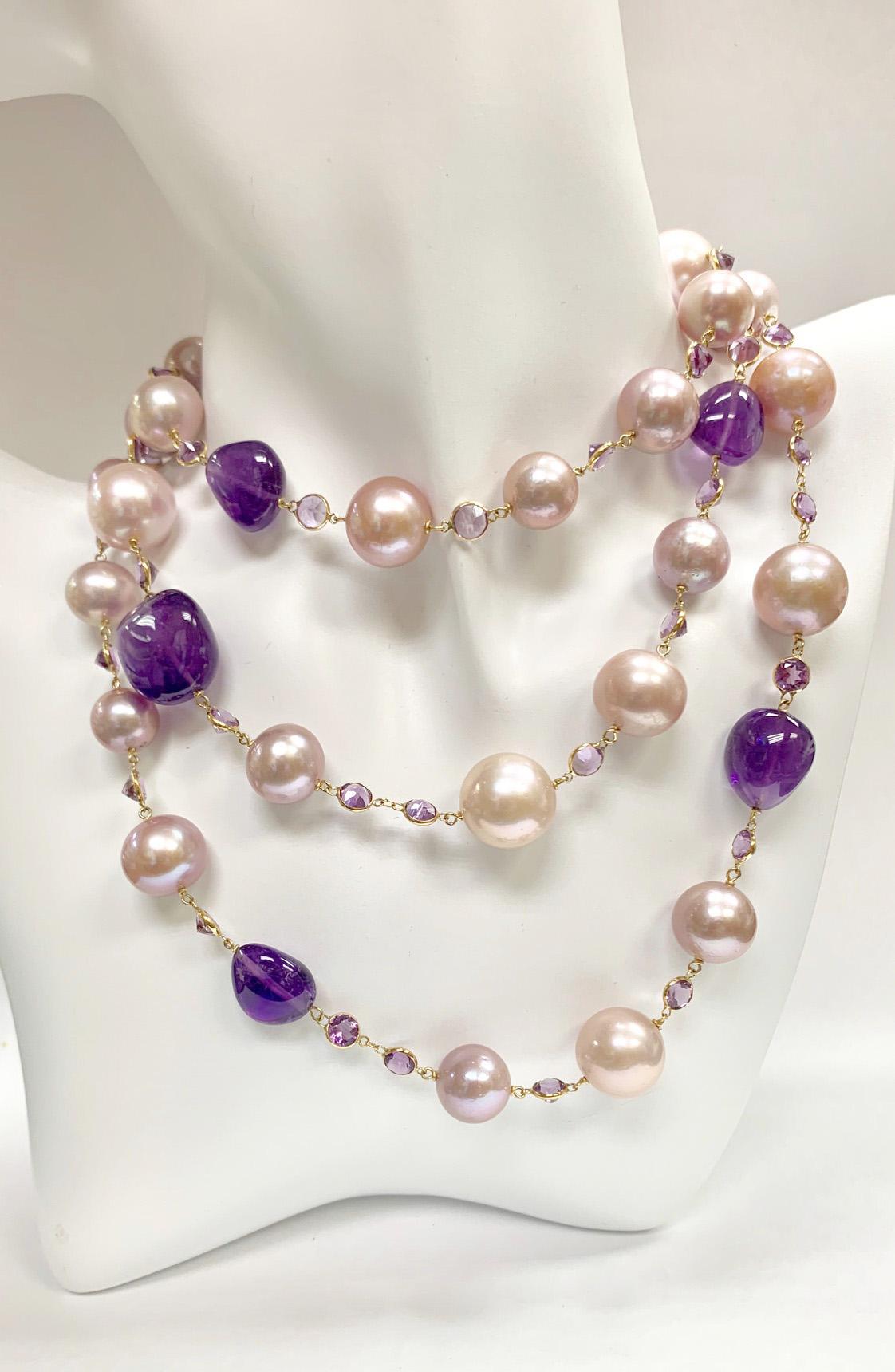 Tahitian Pearl Rope Necklace
Length: 42 inches
Pearls: 13-9mm Pink & Peach pearls
Stones: Amethysts
Gold: 18K Yellow Gold