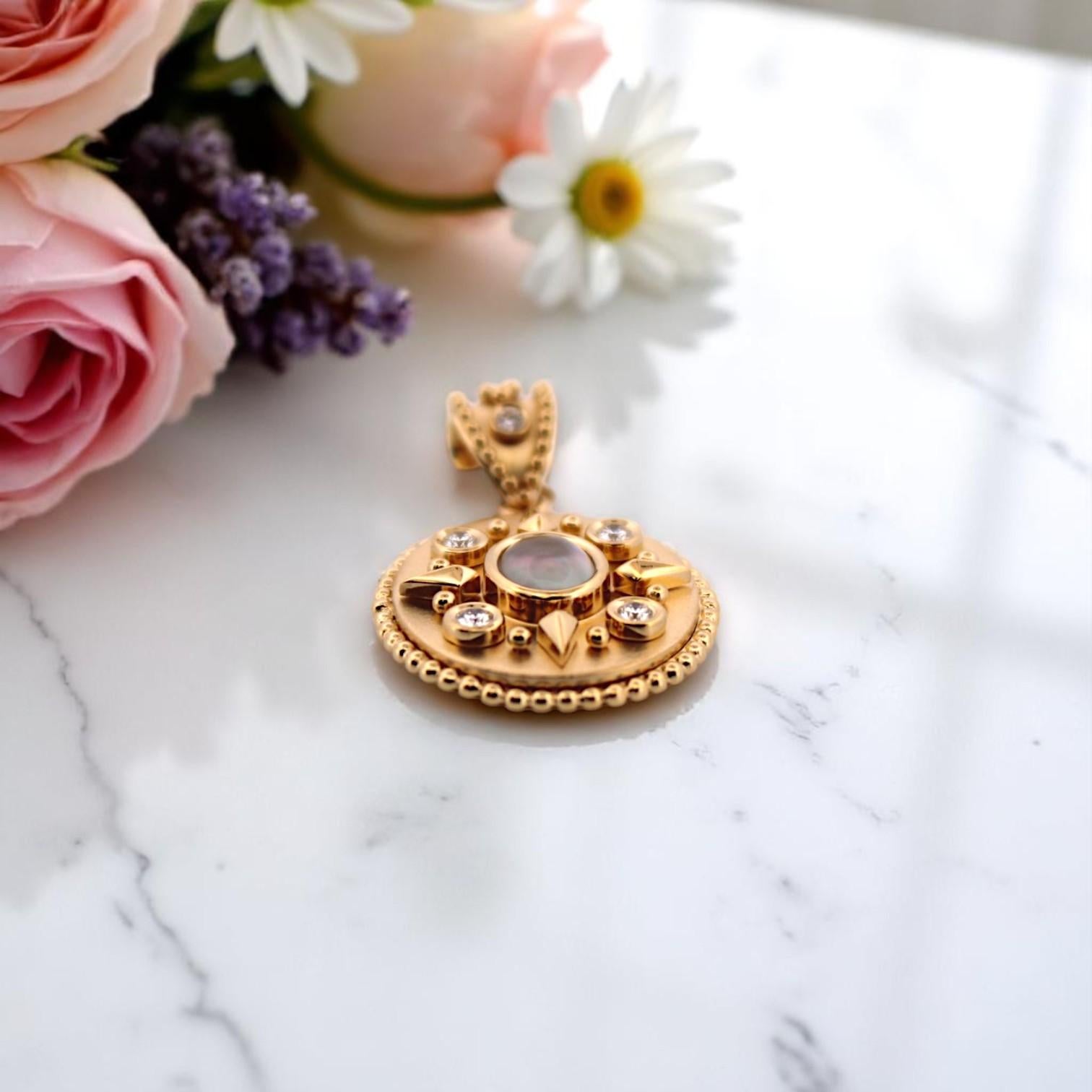 Ethereal and luminous, the Belphoebe Pendant by Mountain Song Jeweler is a tribute to celestial elegance and quiet strength. Handcrafted in glowing 18k yellow gold, this dreamy piece features a 1.18 carat Mother of Pearl centerpiece — soft,