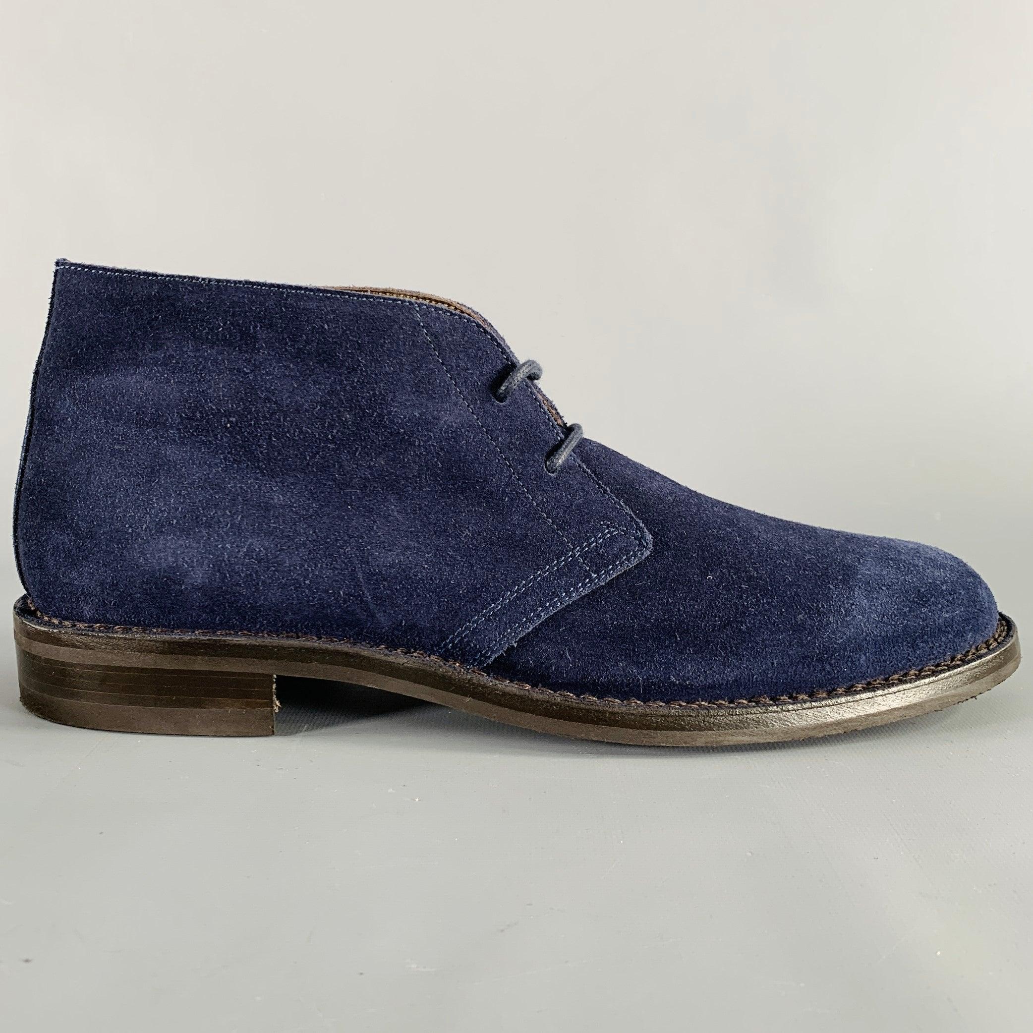 BELSTAFF boots
in a navy blue suede featuring a chukka ankle style, and lace-up closure. Made in Italy.Excellent Pre-Owned Condition. 

Marked:   IT 45 

Measurements: 
  Length: 12.25 inches Width: 4.5 inches Height: 5.5 inches 
  
  
 
Sui Generis
