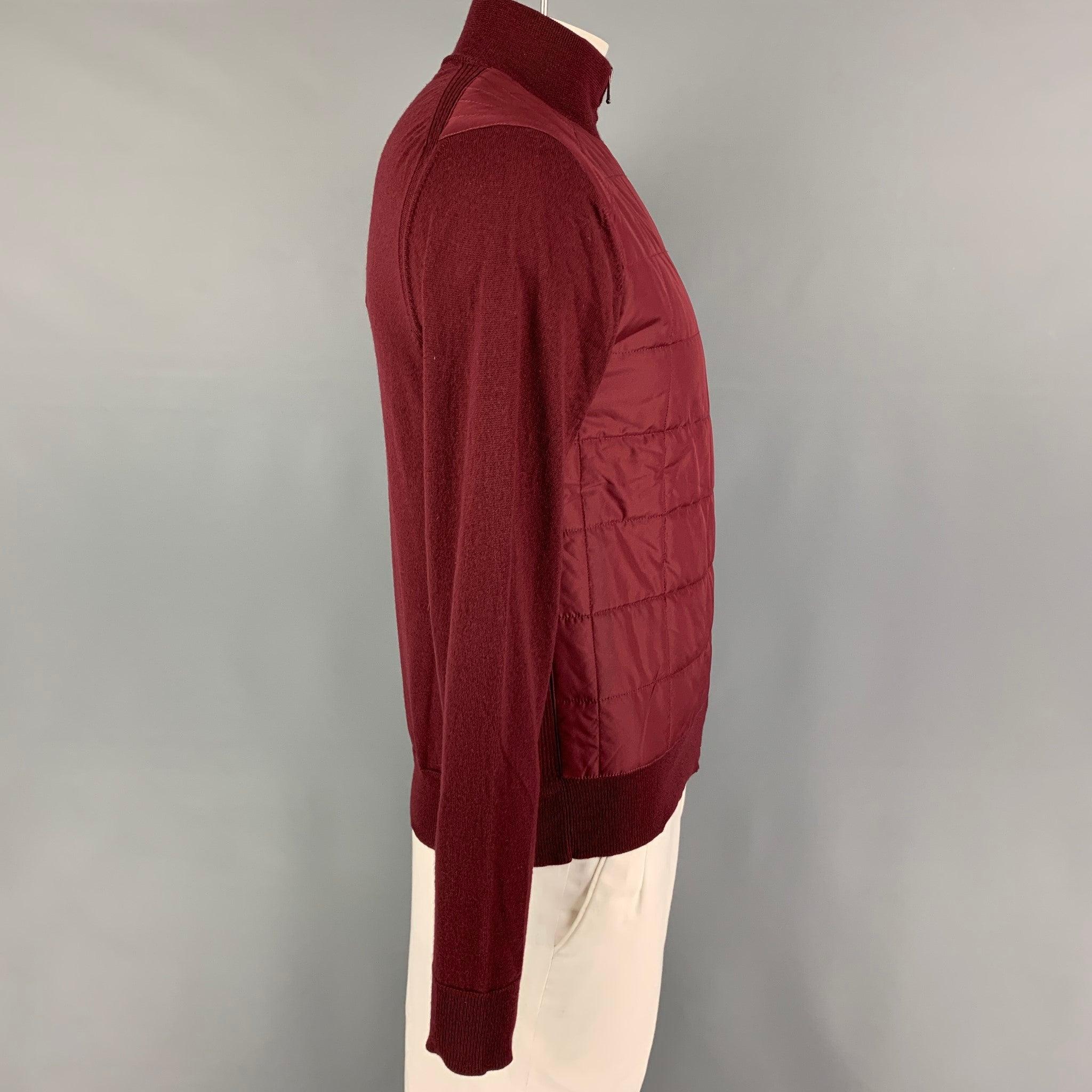 BELSTAFF jacket comes in a burgundy quilted wool / polyester featuring a high collar and a zip up closure.
Excellent
Pre-Owned Condition. 

Marked:   L  

Measurements: 
 
Shoulder: 18 inches Chest: 38 inches Sleeve:
27.5 inches Length: 26.5 inches