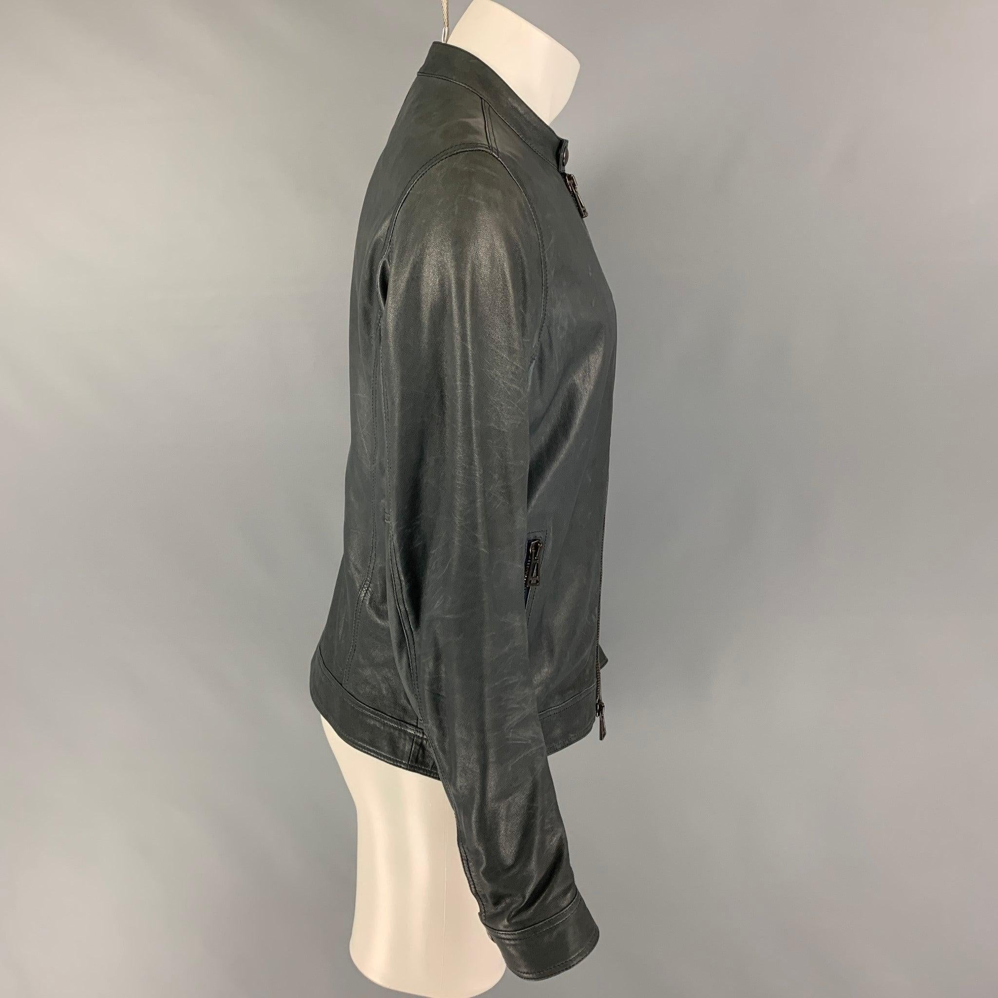 BELSTAFF jacket comes in a gray leather featuring a snap button collar detail, zipper pockets, and a full zip up closure.
 Very Good
 Pre-Owned Condition. 
 

 Marked:  50 
 

 Measurements: 
  
 Shoulder: 17.5 inches Chest: 40 inches Sleeve: 27