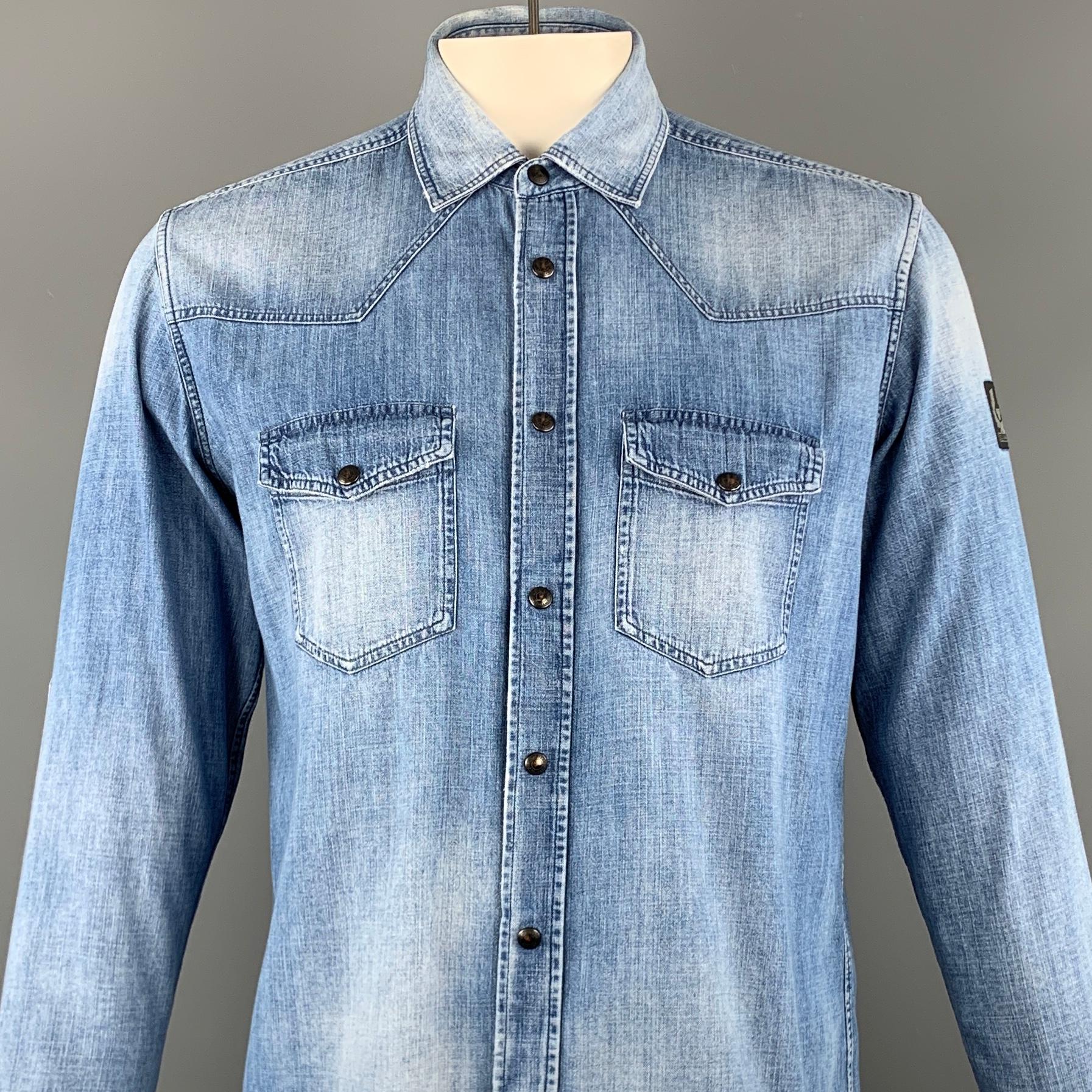 BELSTAFF long sleeve shirt comes in a blue washed cotton / viscose featuring a button up style, western, and a snap button closure. 

Excellent Pre-Owned Condition.
Marked: XL

Measurements:

Shoulder: 17.5 in. 
Chest: 44 in. 
Sleeve: 27.5 in.