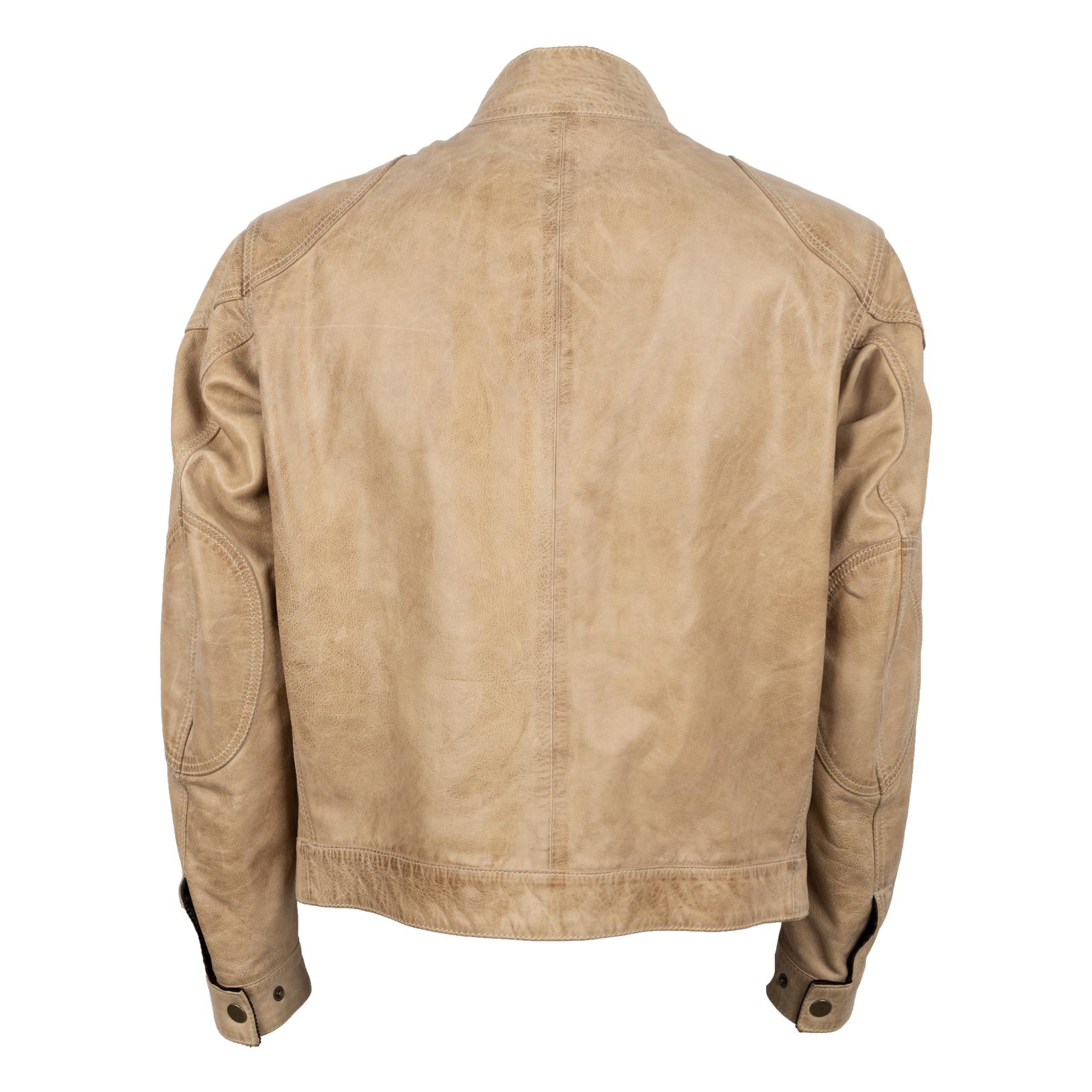 The Belstaff vintage Gangster Jacket in beige color is a classic piece of outerwear that features a stylish and timeless design. This jacket is made from high-quality leather, which provides both durability and a comfortable fit. It features a front