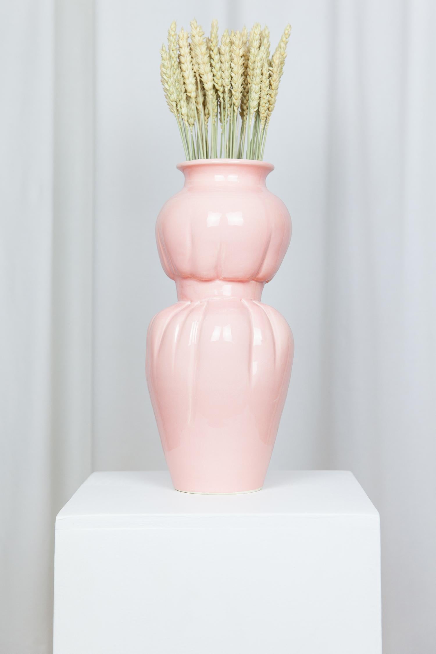 BELT VASE 
Vase in white earthenware, glazed in pink.
This piece is designed and handcrafted in the south of France.

Lola Mayeras — Designer 
In parallel with her profession as a fashion designer, Lola Mayeras developed a creative universe