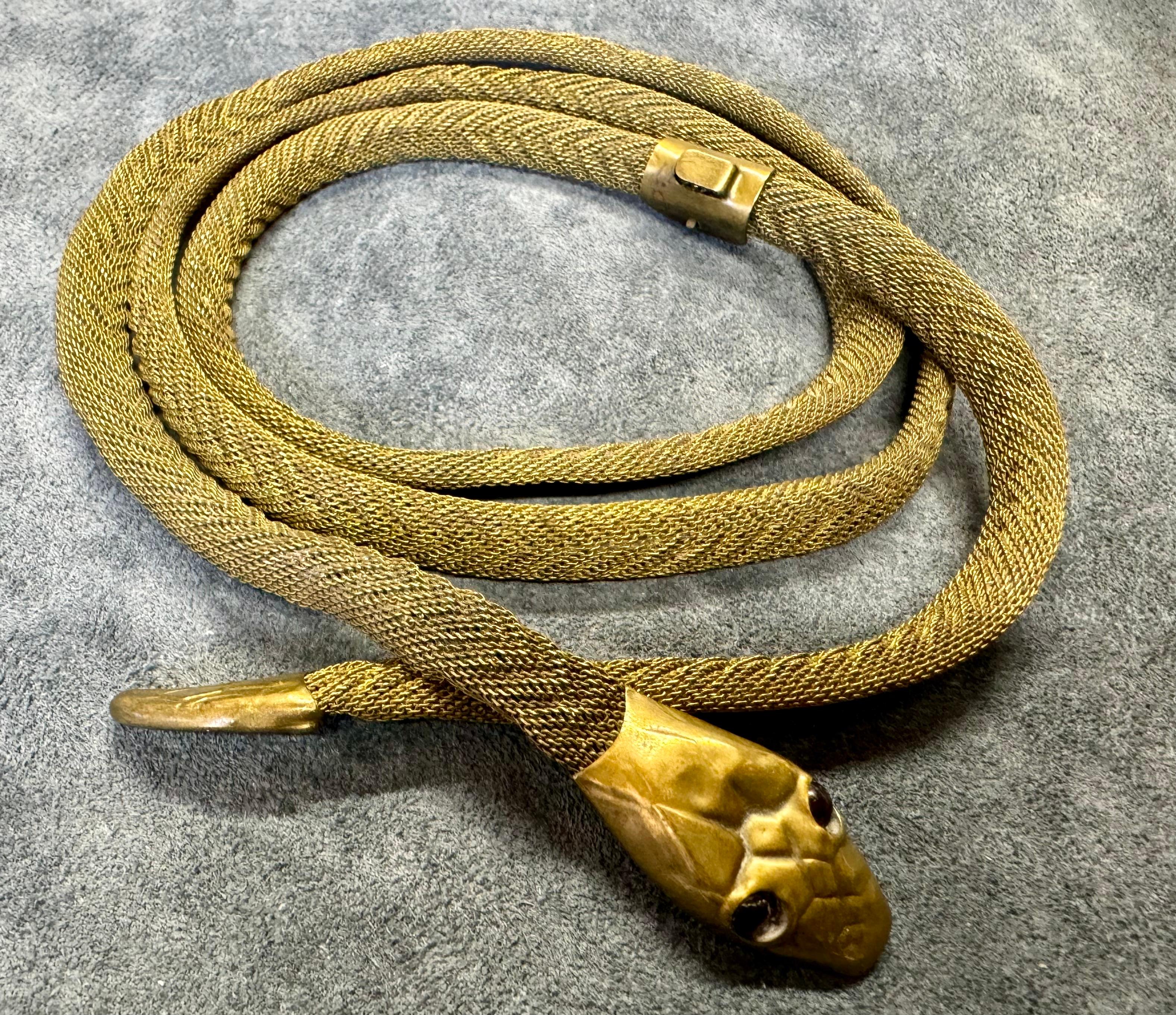 Belt with a snake motif, early 20th century
Length 104cm
Adjustable.
Old antique belt.
Manufacturer's mark in the picture.
Unknown manufacturer.
Probably some Brass or other gold colored metal.
The belt is embossed with a snake's head.
See the