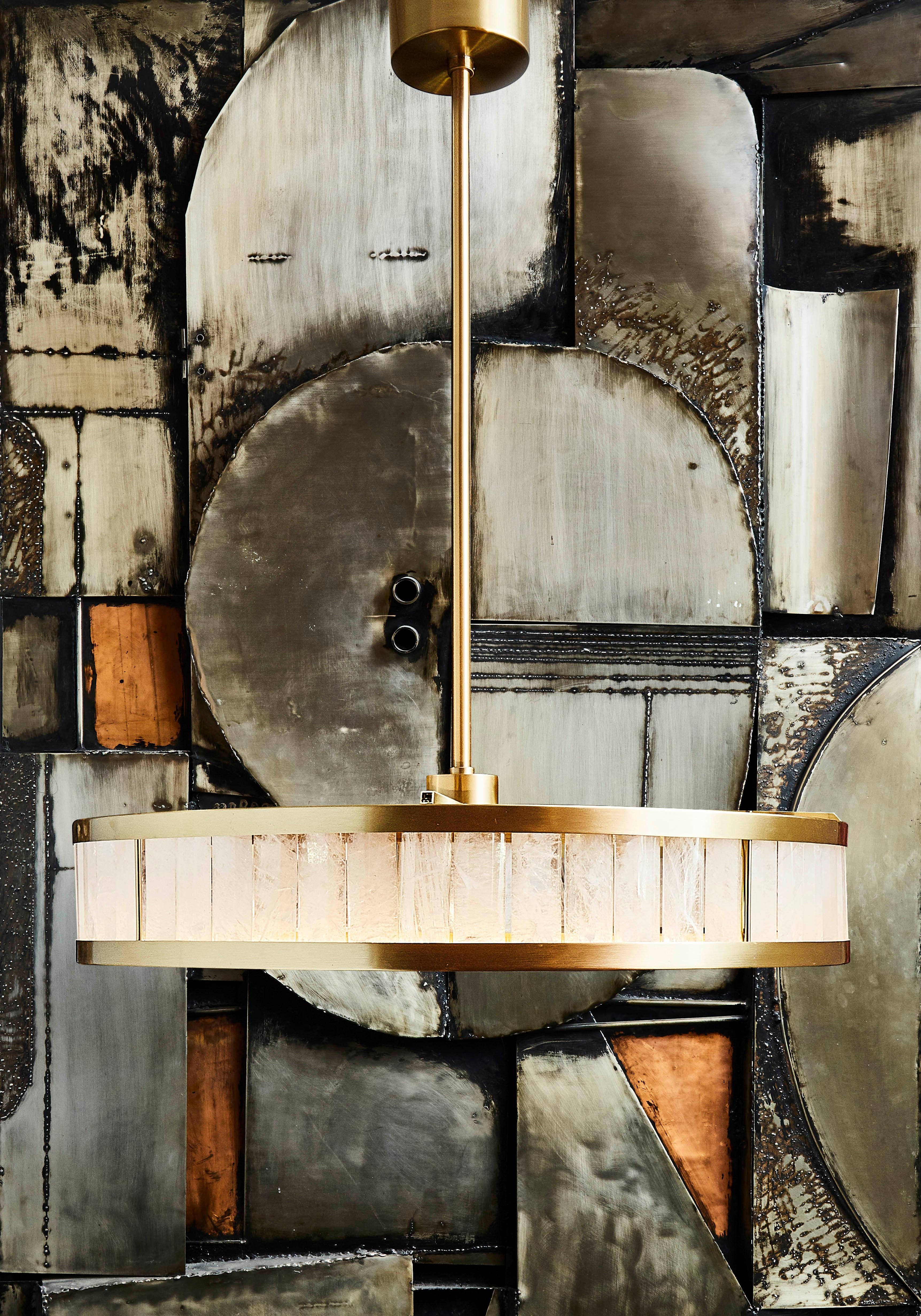 Exceptional chandelier in brushed brass and bevelled rock crystal plates. 
Creation by Studio Glustin
