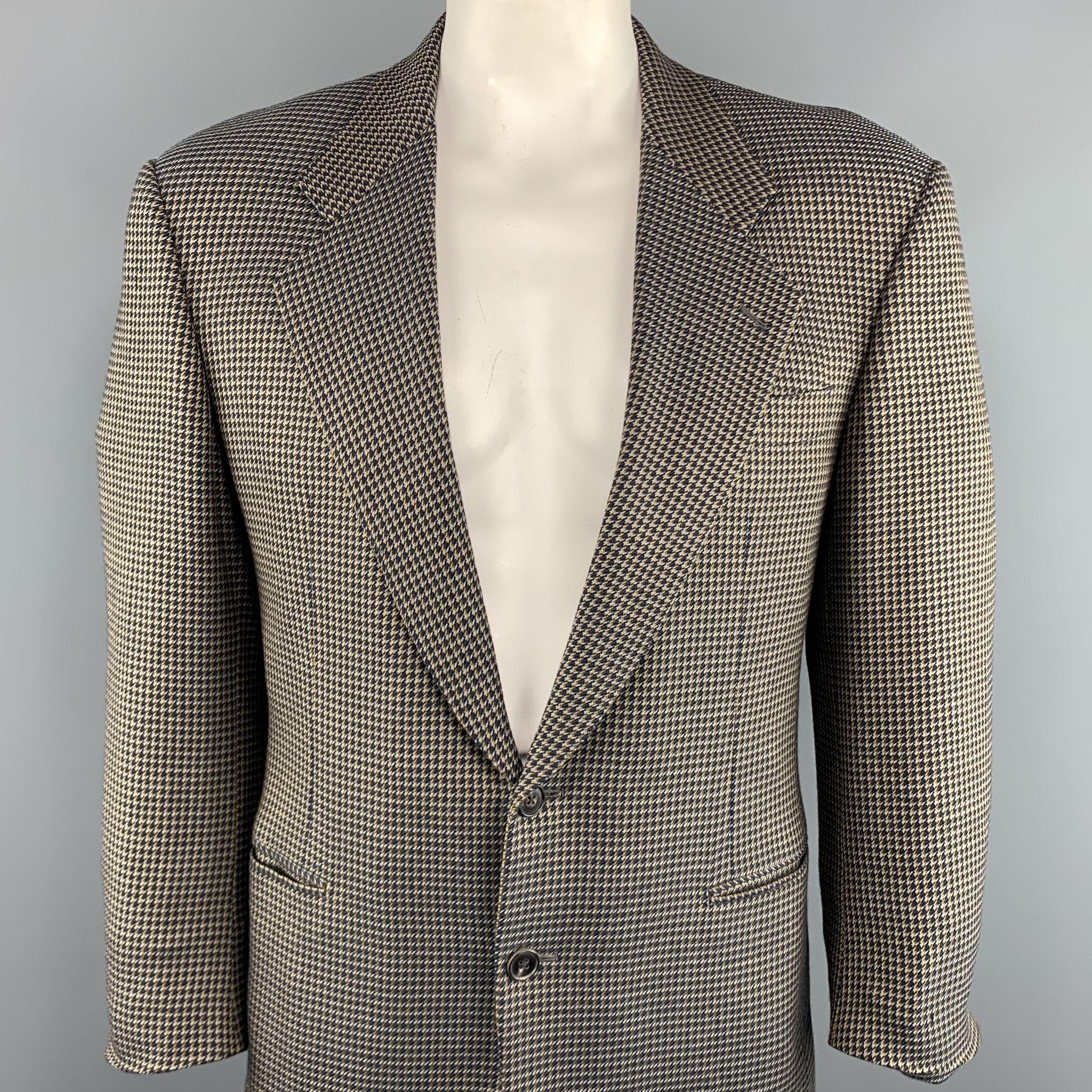BELVEST Sport Coat comes in a brown & navy houndstooth wool featuring a notch lapel style, padded shoulders, slit pockets, and a two button closure. Made in Italy.

Excellent Pre-Owned Condition.
Marked: 50

Measurements:

Shoulder: 20 in. 
Chest: