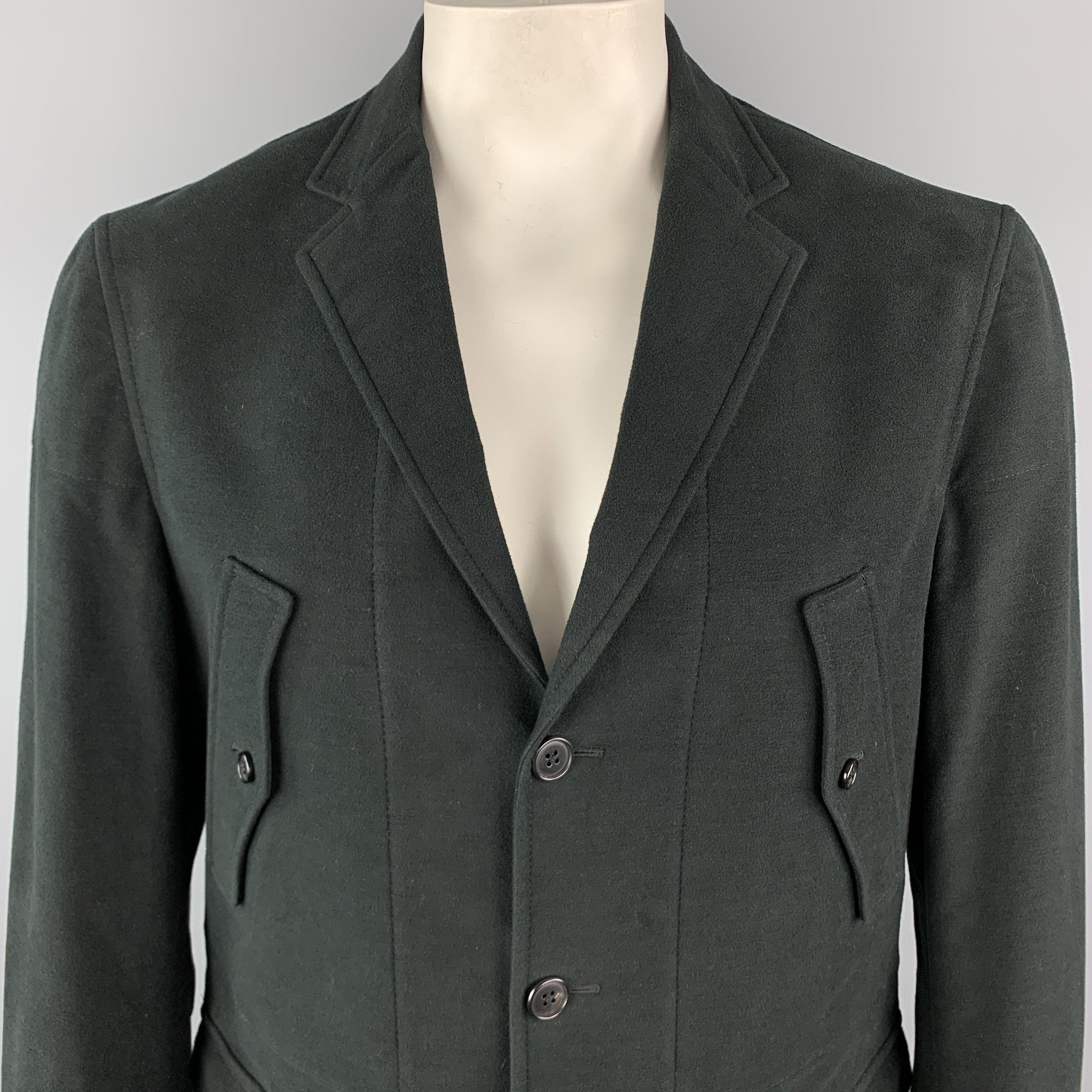 BELVEST Jacket comes in a black solid cotton / elastane material, with a notch lapel, patch pockets, three buttons at closure, single breasted, functional buttons and a leather trim at cuffs, elbow patches, a single vent at back, unlined. Made in