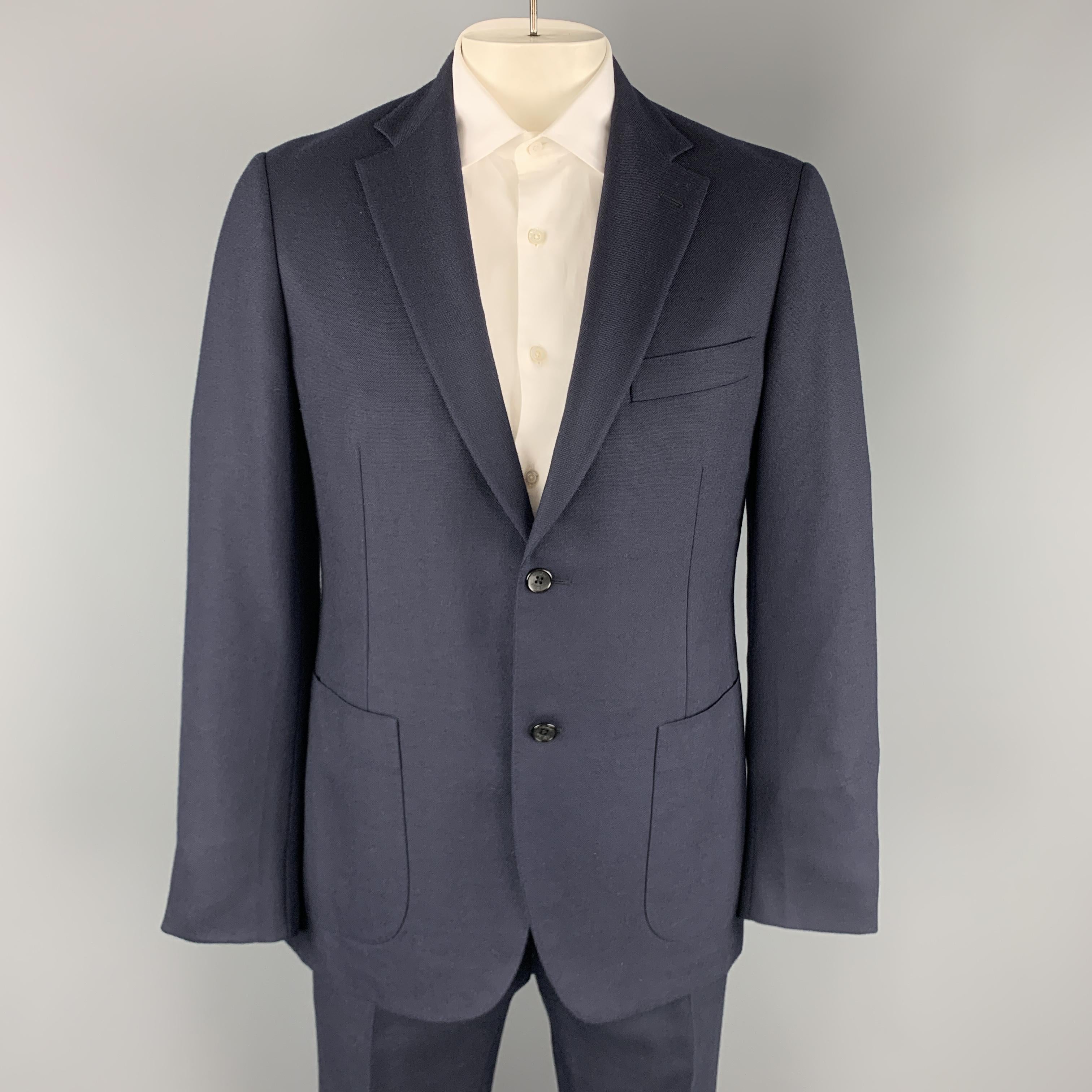 BELVEST suit comes in woven wool and includes a single breasted, two button sport coat with notch lapel and matching flat front trousers. Made in Italy.

Excellent Pre-Owned Condition.
Marked: IT 52

Measurements:

-Jacket
Shoulder: 18 in.
Chest: 45