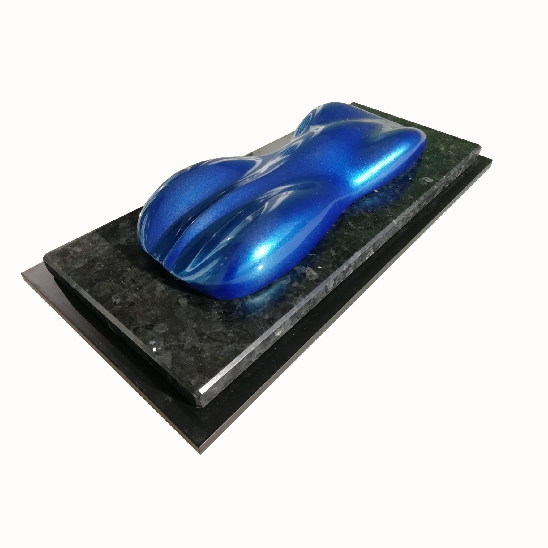 Blue Lago

A lacquered and varnished marble composite model of a racing car.
On a marble and lacquered rectangular wood base.

Belzoni finds inspiration in the legendary racing cars of the 1950s and the 1960s.
His elegant sculptures epitomize the