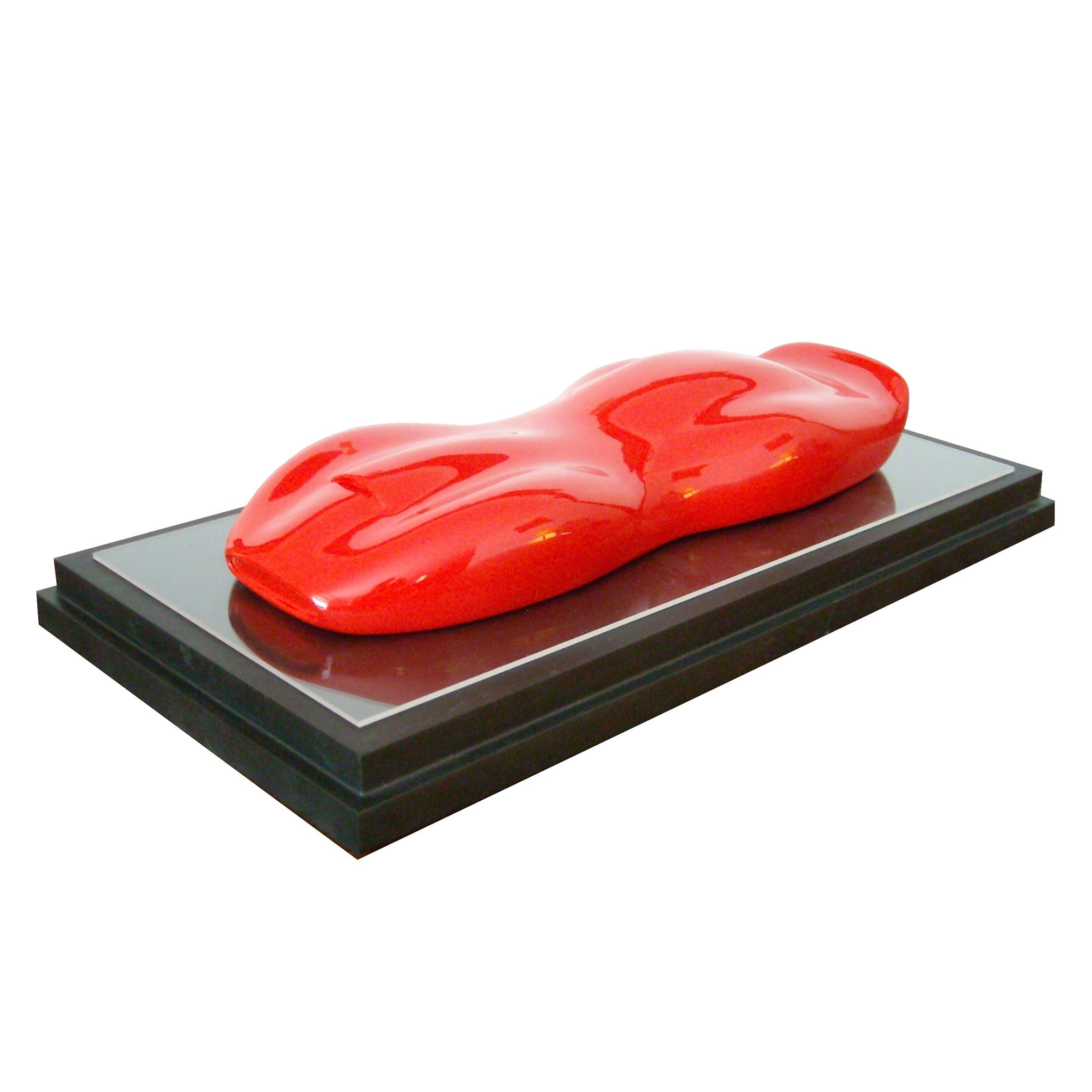 Modena

A red lacquered and varnished marble composite model of a racing car.
On a dark lacquered rectangular wood base.

Belzoni finds inspiration in the legendary racing cars of the 1950s and the 1960s.
His elegant sculptures epitomize the