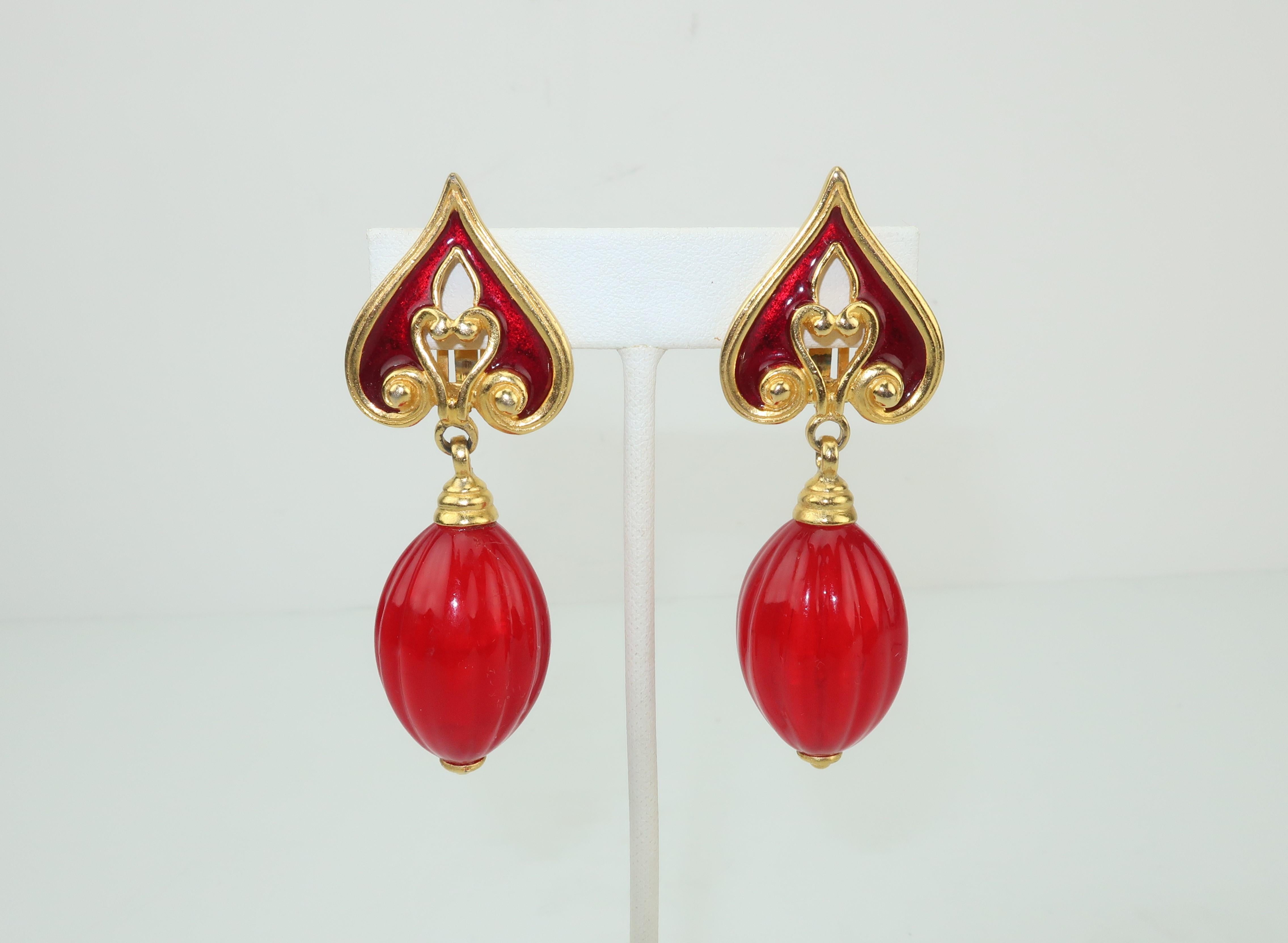 Red and gold ... a stunning combination!  This lovely dangle clip on earring by Issac Manevitz for his jewelry line, Ben-Amun, is an excellent example of sophisticated style.  The spade shaped gold tone base is decorated with swirls and a red enamel