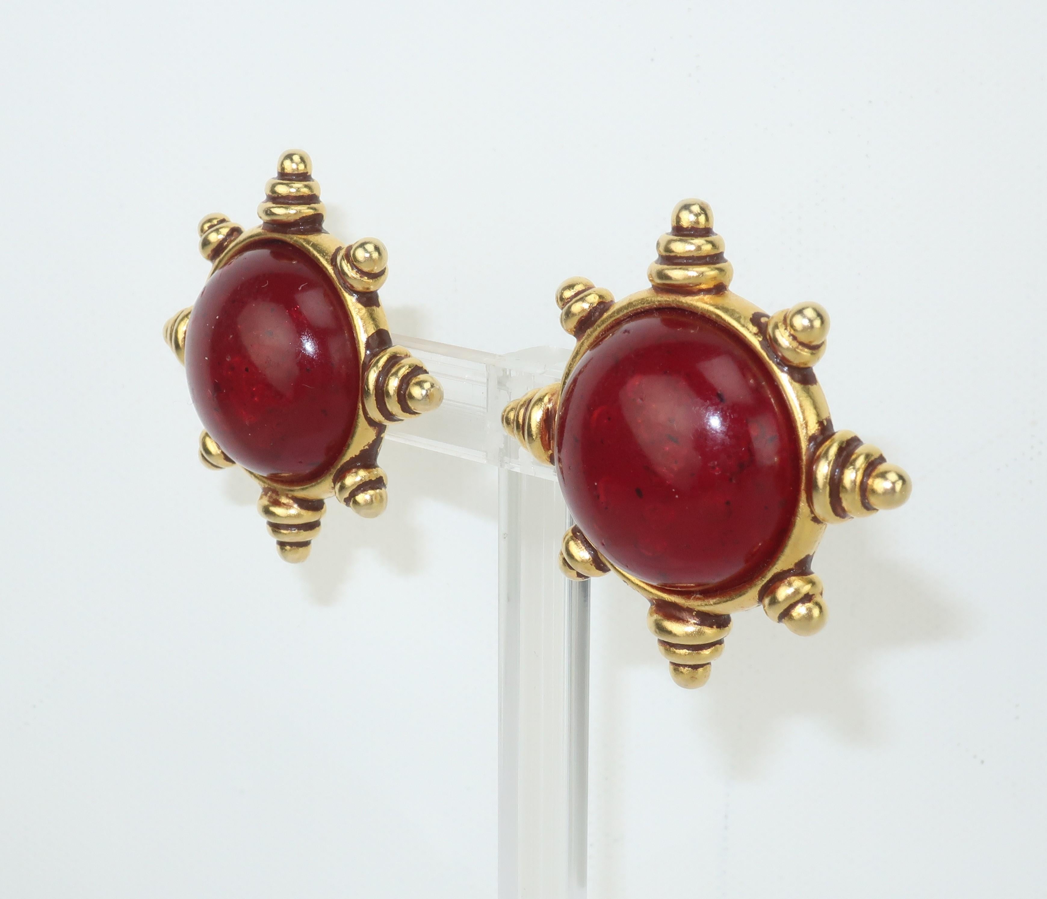 Deep cherry red and gold ... a stylish combination for these 1980's clip on earrings by Issac Manevitz for his jewelry line, Ben-Amun.  The Byzantine style gold tone setting is beautifully detailed and serves to frame a resin 'stone' which is