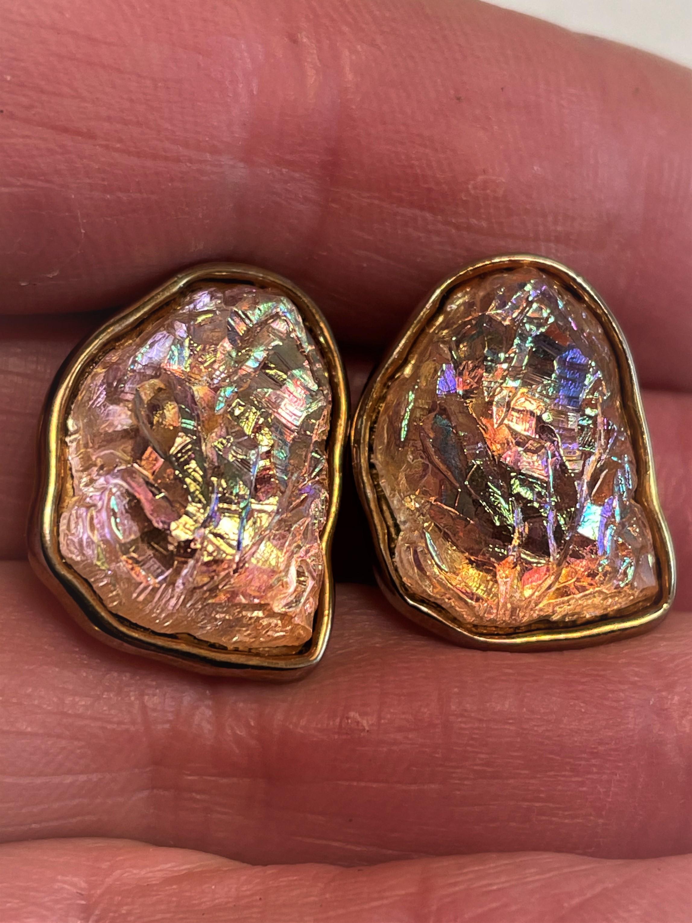 These are such stylish modernist clip on earrings made by Ben-Amun and clearly marked on the back. The vibrant, iridescent pinkish orange glass with an aurora borealis AB (rainbow) finish, has a free form shape and the molded glass surface is