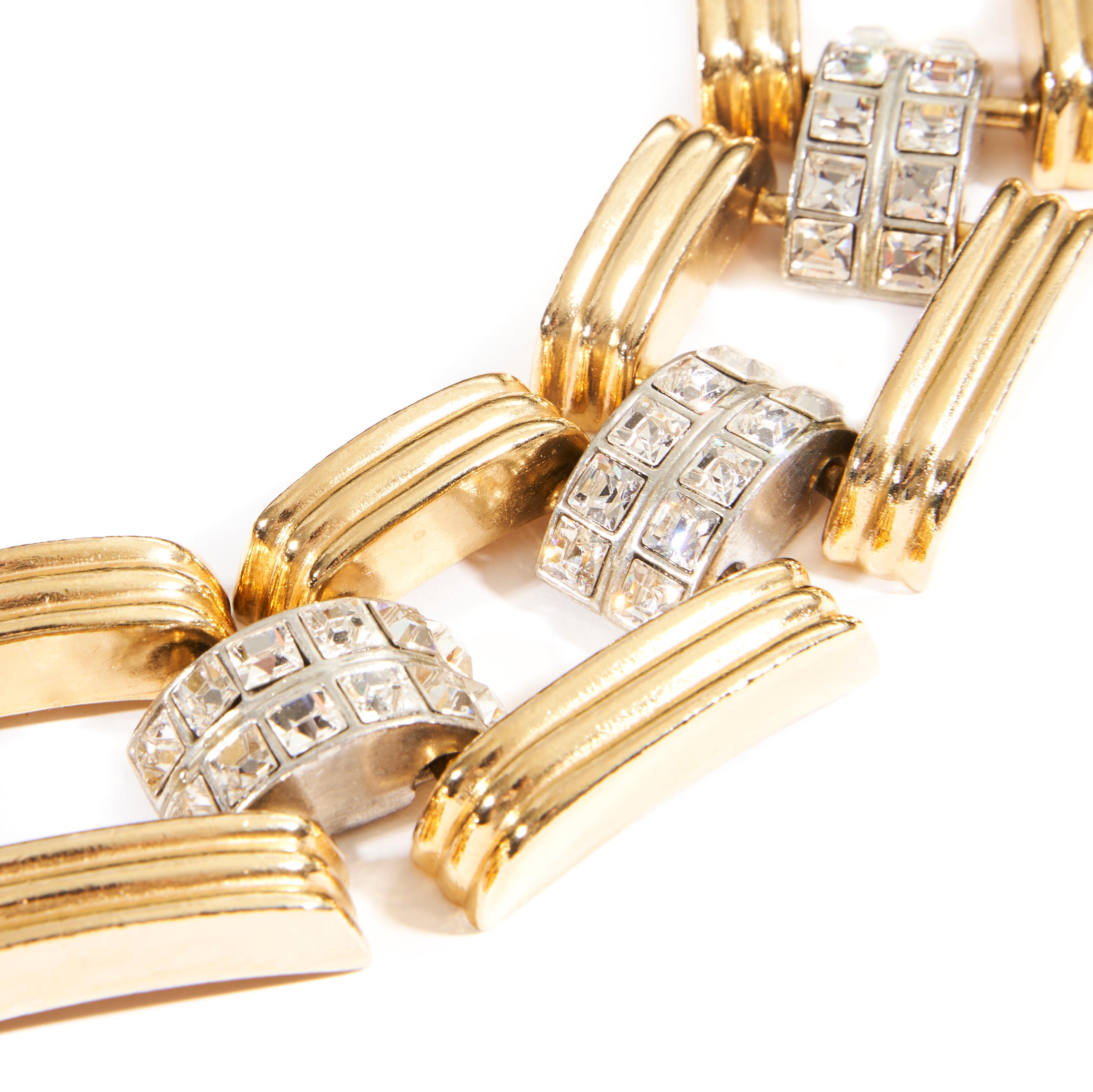Metal: 24K gold-plated brass
Genuine Clear Crystal Stones
Box and Tongue Closure
Hand made in New York City, USA
