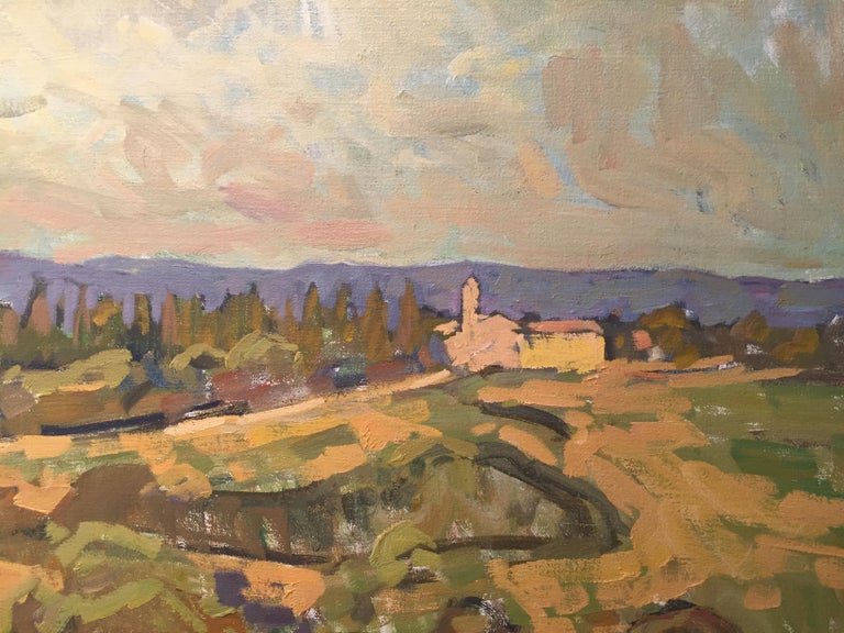 “Evening Cloud” (2019, Oil on linen, 35.43 x 49.21 inches). An oil painting, created en plein air in Tuscany. Rolling hills illuminated and shadowed by the natural light of a clouded sky. The foreground depicts green plowed land encompassed in
