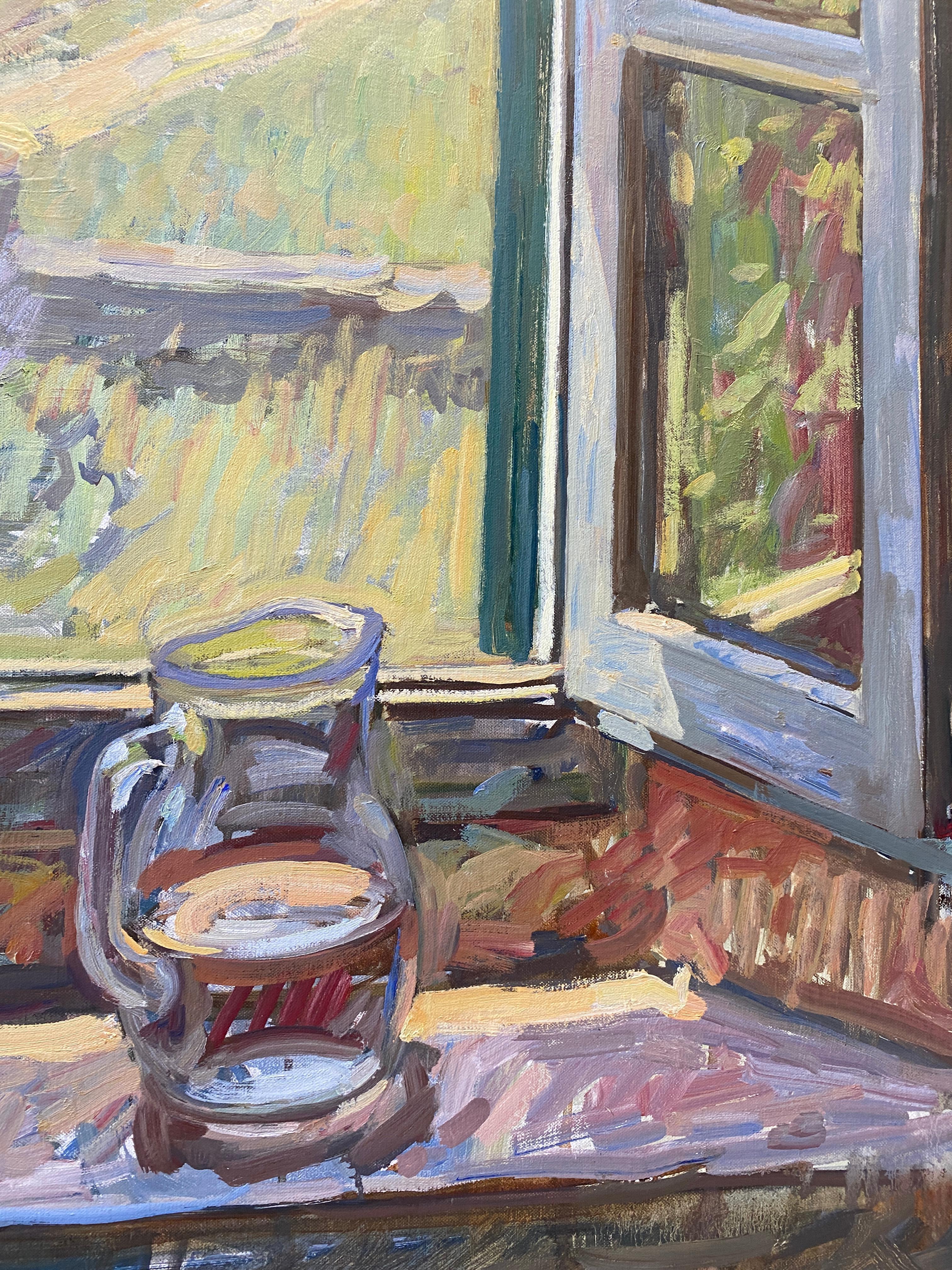 A large, vertically-oriented oil painting of an open window's view to the outdoors, painted from an interior of the artist's home in Tuscany. Situated in the kitchen, facing the window, a small glass vase of roses sit centrally in our view, beside a