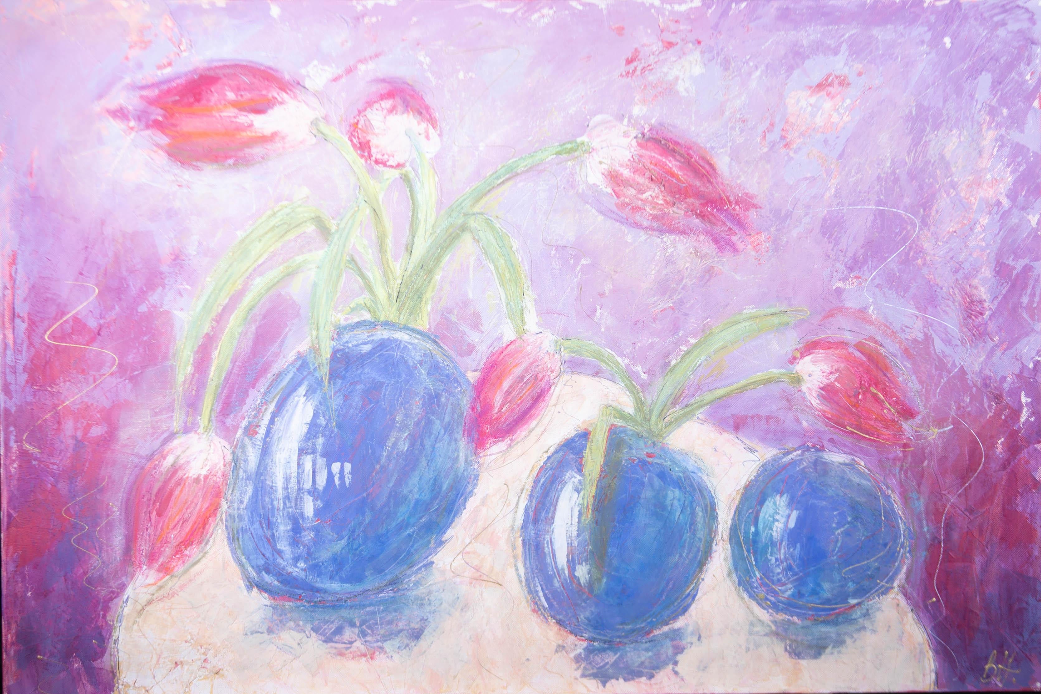 A dynamic and joyful mixed media piece using oil, acrylic and gold pen details over an impasto, textured ground. The still life shows pink tulips in three blue vases on a colorful background. The artist has initialed to the lower right corner and