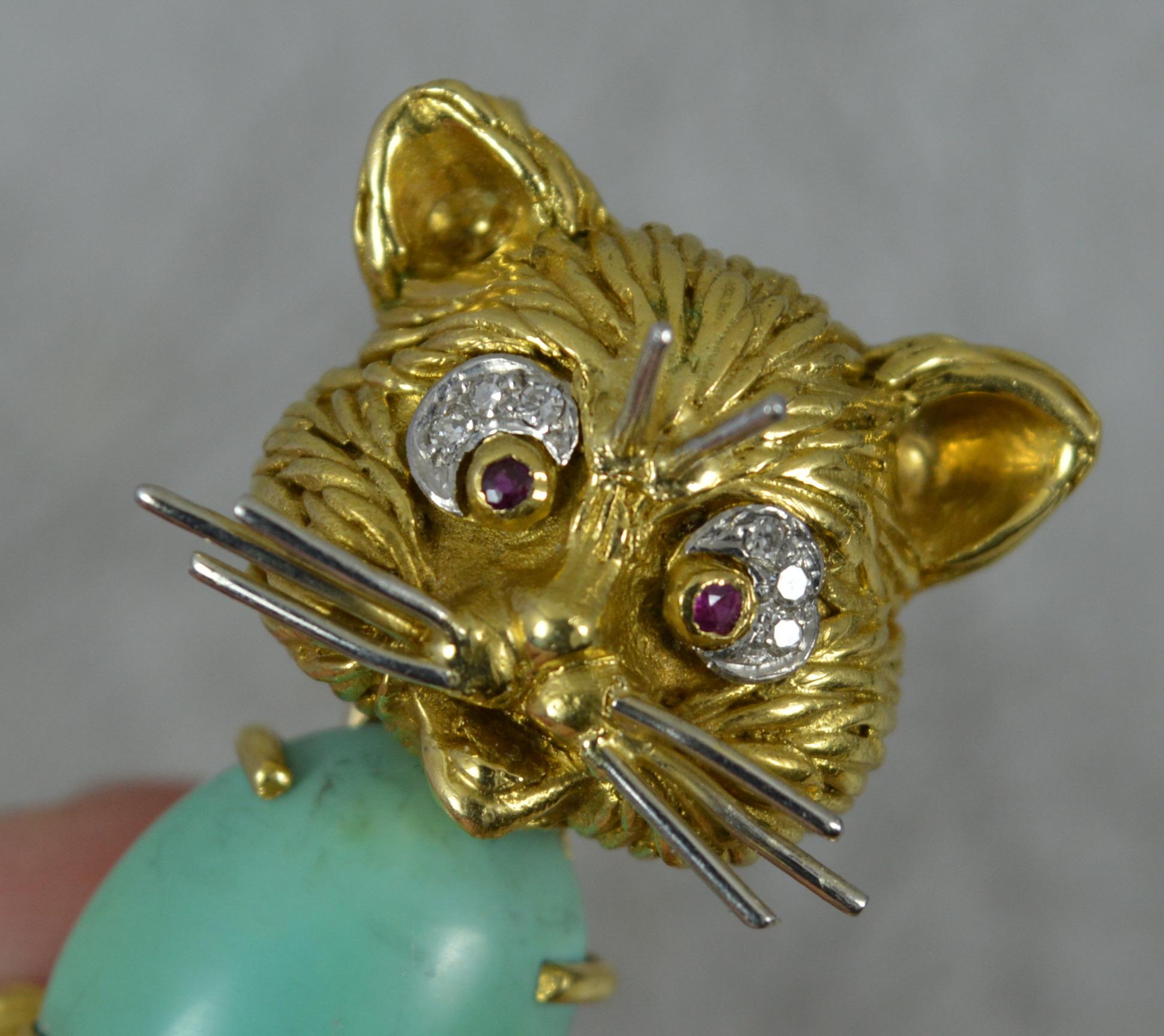 A captivating English made vintage brooch.
A solid 18 carat yellow gold example of whimsical cat form with white gold whiskers.
Designed with a large oval turquoise to the body, ruby stones set for eyes and diamonds set above.
Made by Ben