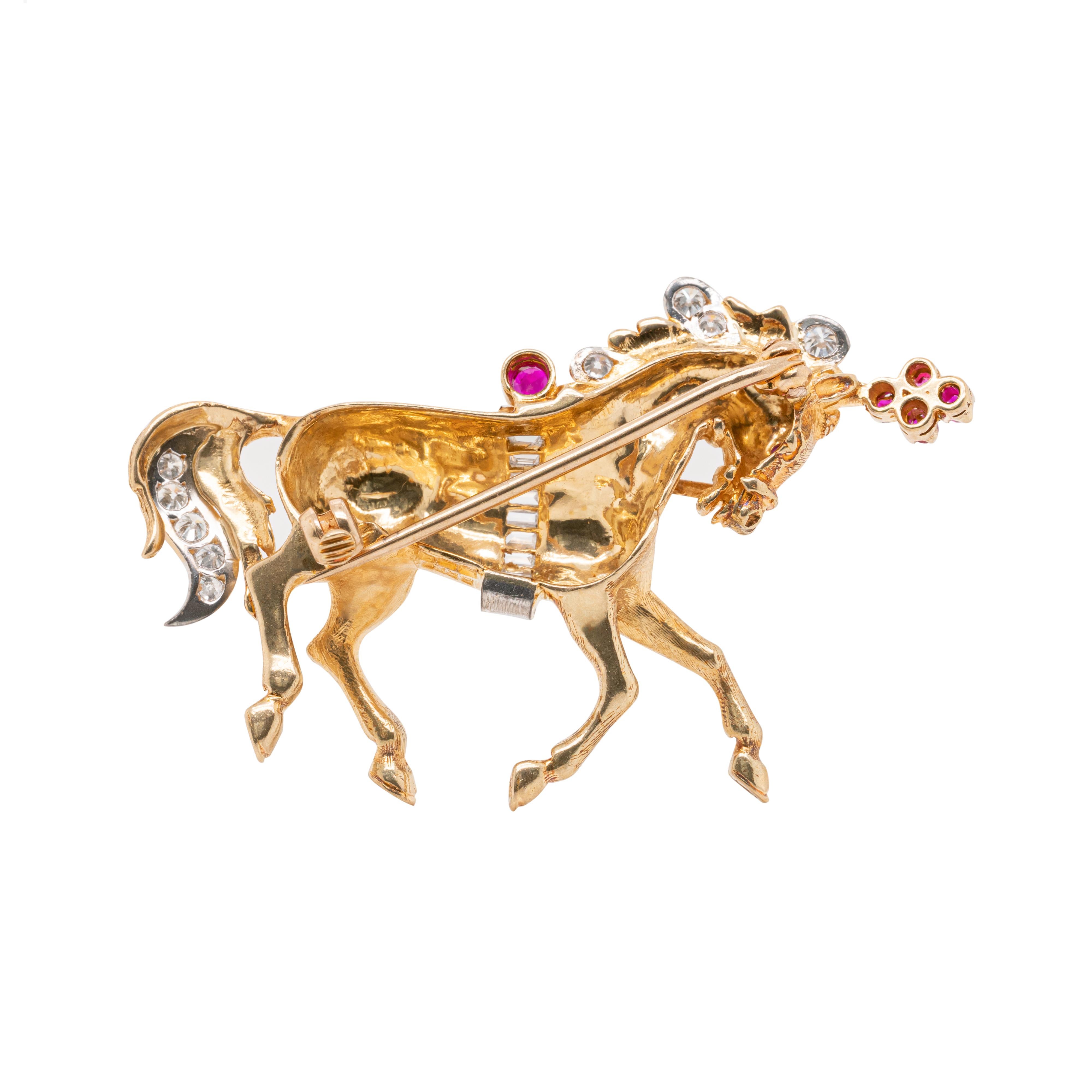 This wonderful horse brooch designed by British jeweller, Ben Rosenfeld is crafted in 18 carat yellow gold. The piece is set with 6 rubies. totalling to an approximate weight of 0.14 carats and further inlaid with 9 baguette cut diamonds and 9 round