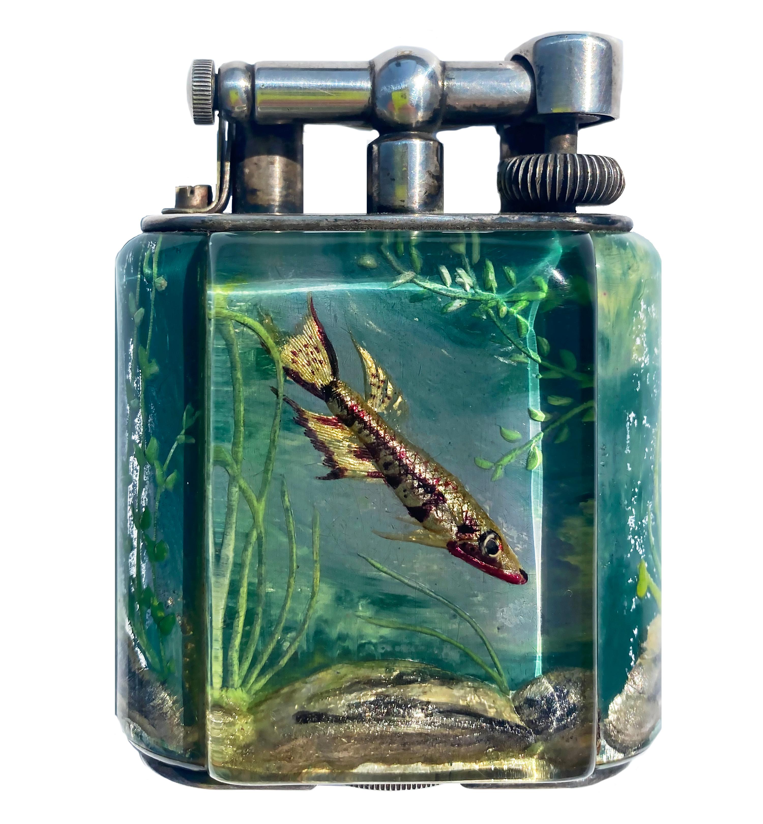 Rare
1950s Dunhill Aquarium Lighter Created by Artist Ben Schillingford
Handmade in England
Service Size
In Working Condition

Alfred Dunhill was an English tobacconist, entrepreneur and inventor. He is the progenitor of Alfred Dunhill Ltd. a