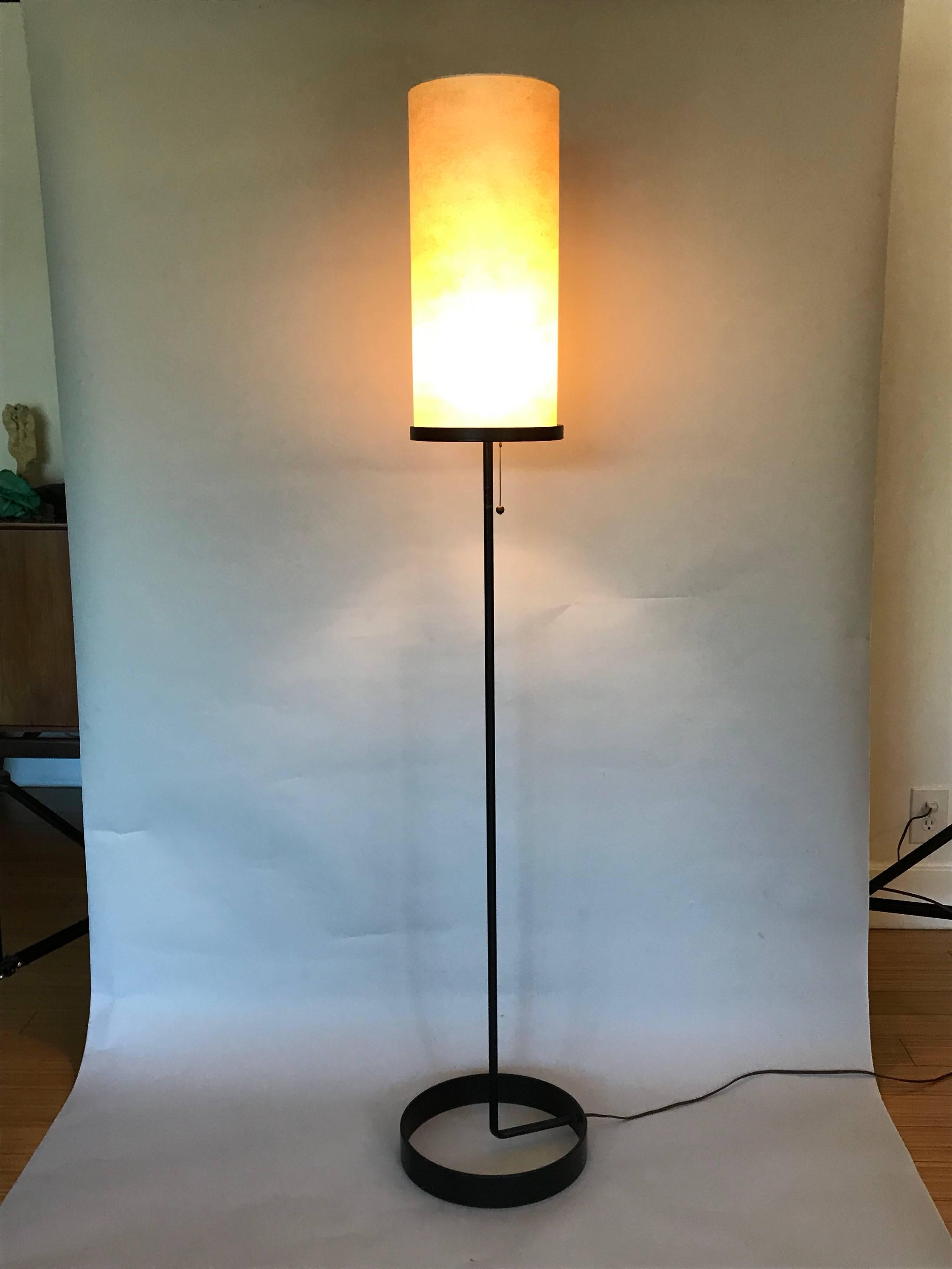 1918-1985,
A rare modernist design.
Made of iron with the original silk-paper shade and original hardware.
The shade shows minor wear with patina as well as the base.
No major damage, works great.
It's great as an accent for mood lighting and as an