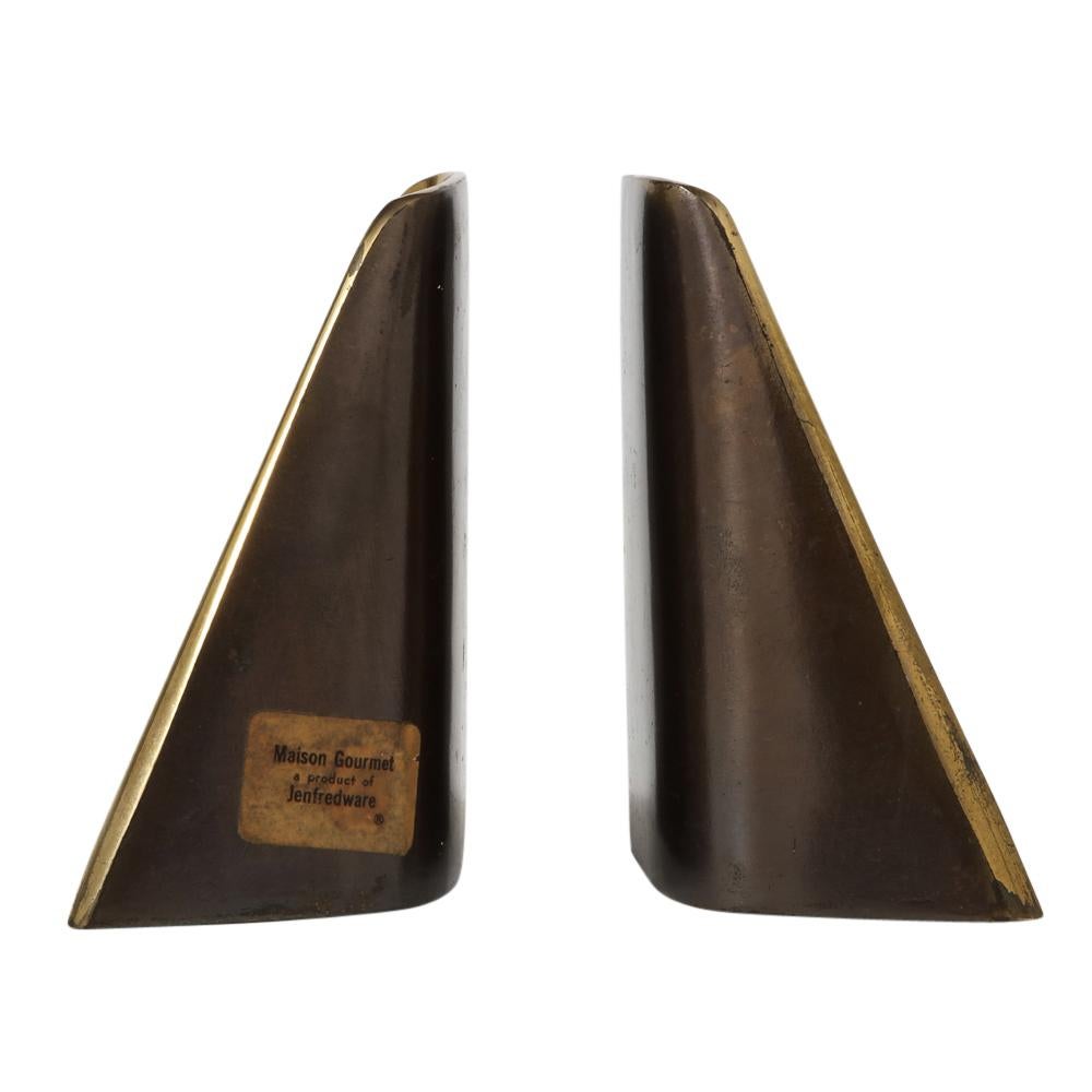 Ben Seibel bookends, brass shovel signed. In good original condition. Minimalist form bookends with brass plating over white metal. Front are glossy lacquered brass and backs having a dark bronze matte finish. Both retain original labels which read: