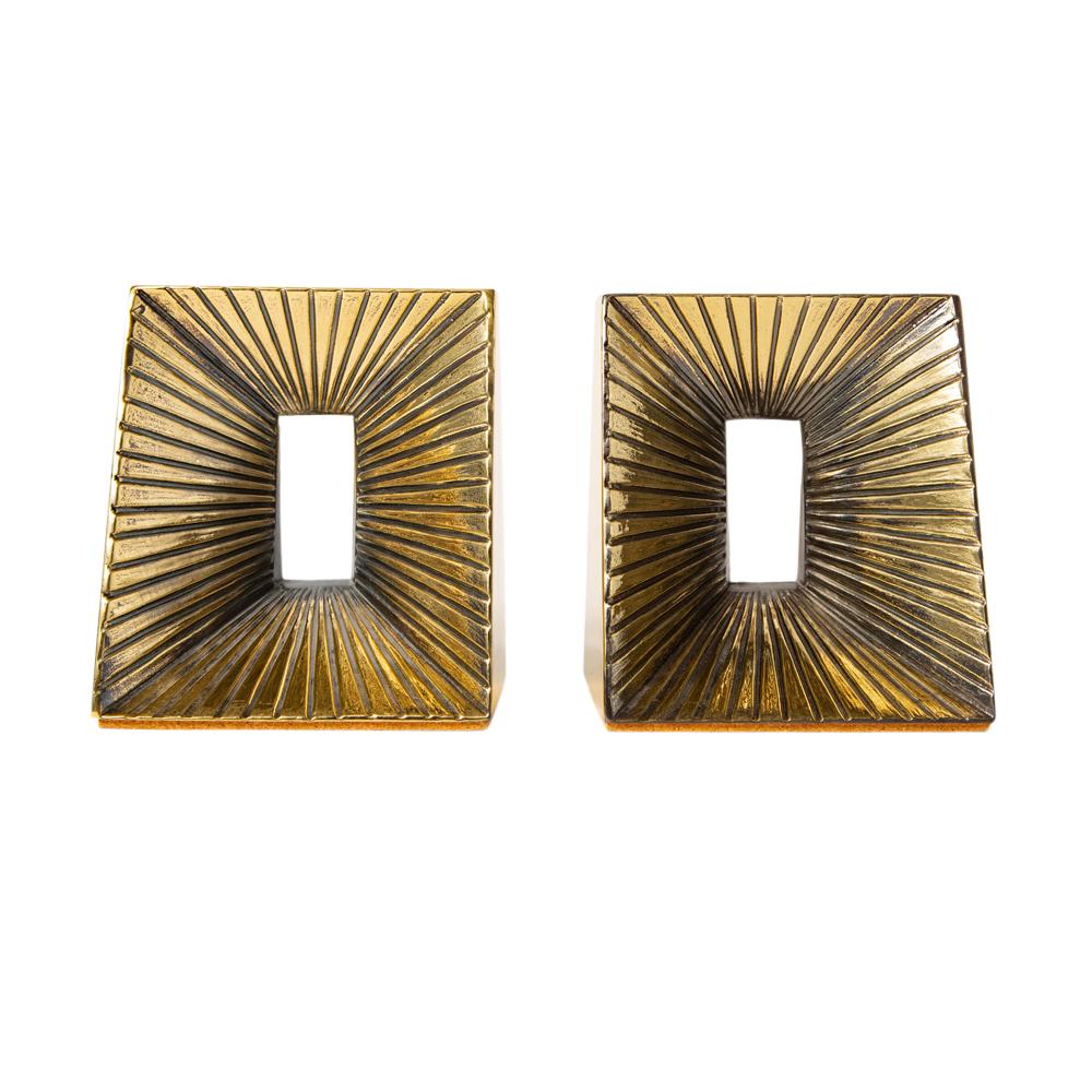 Ben Seibel brass plated bookends sunburst. Pair of small scale brass over white metal bookends, decorated with incised lines that create a sunburst effect. We've sold a pair previously with a label which read: 