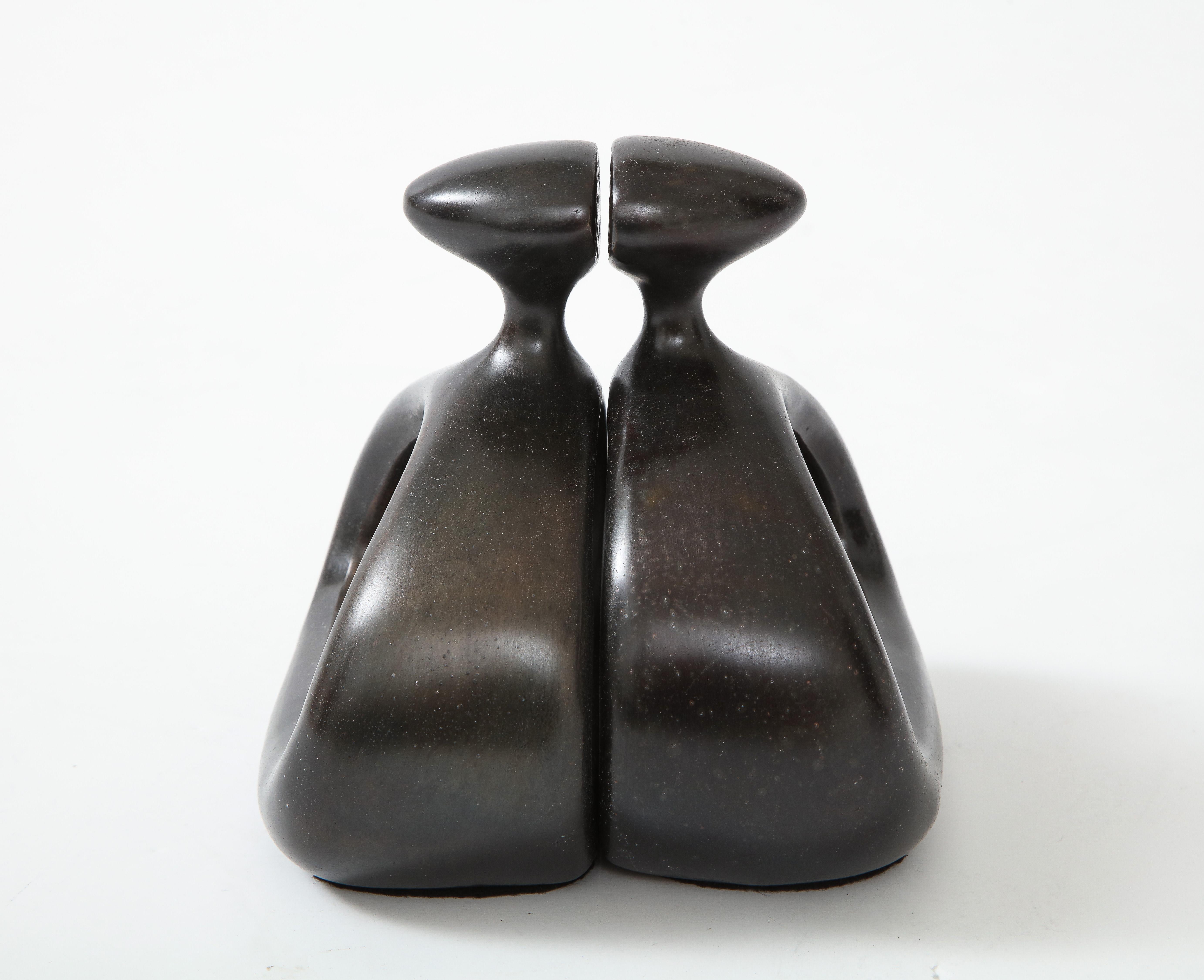 Set of modernist stylized stirrup bookends in a dark bronze.